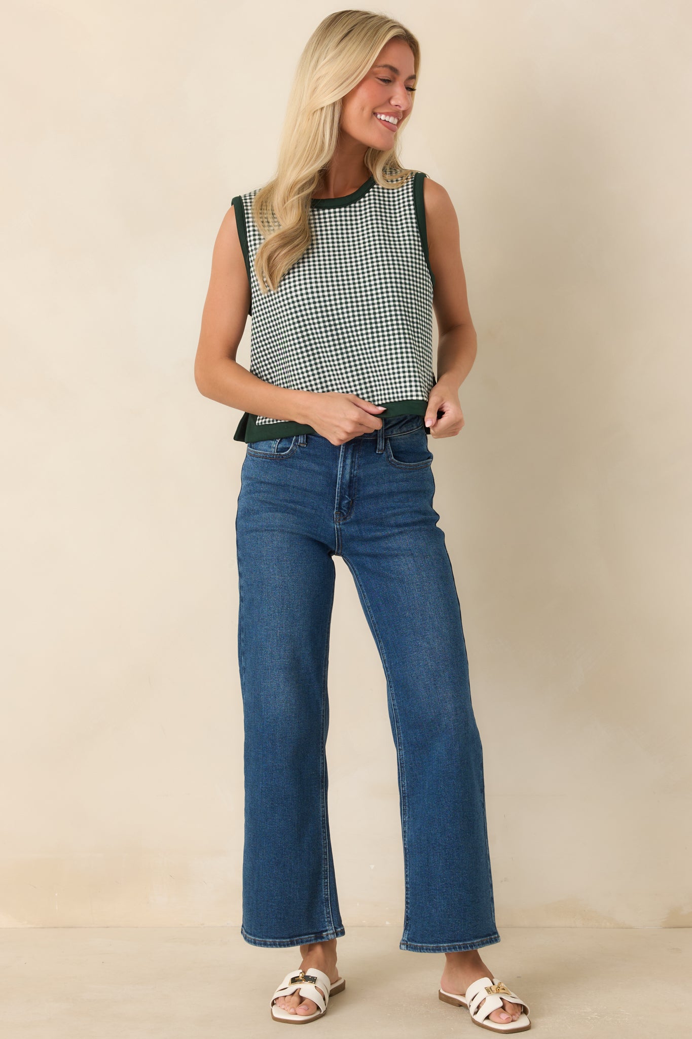Cropped gingham top showcasing solid trim accents, side slits, and a clean structured shape.