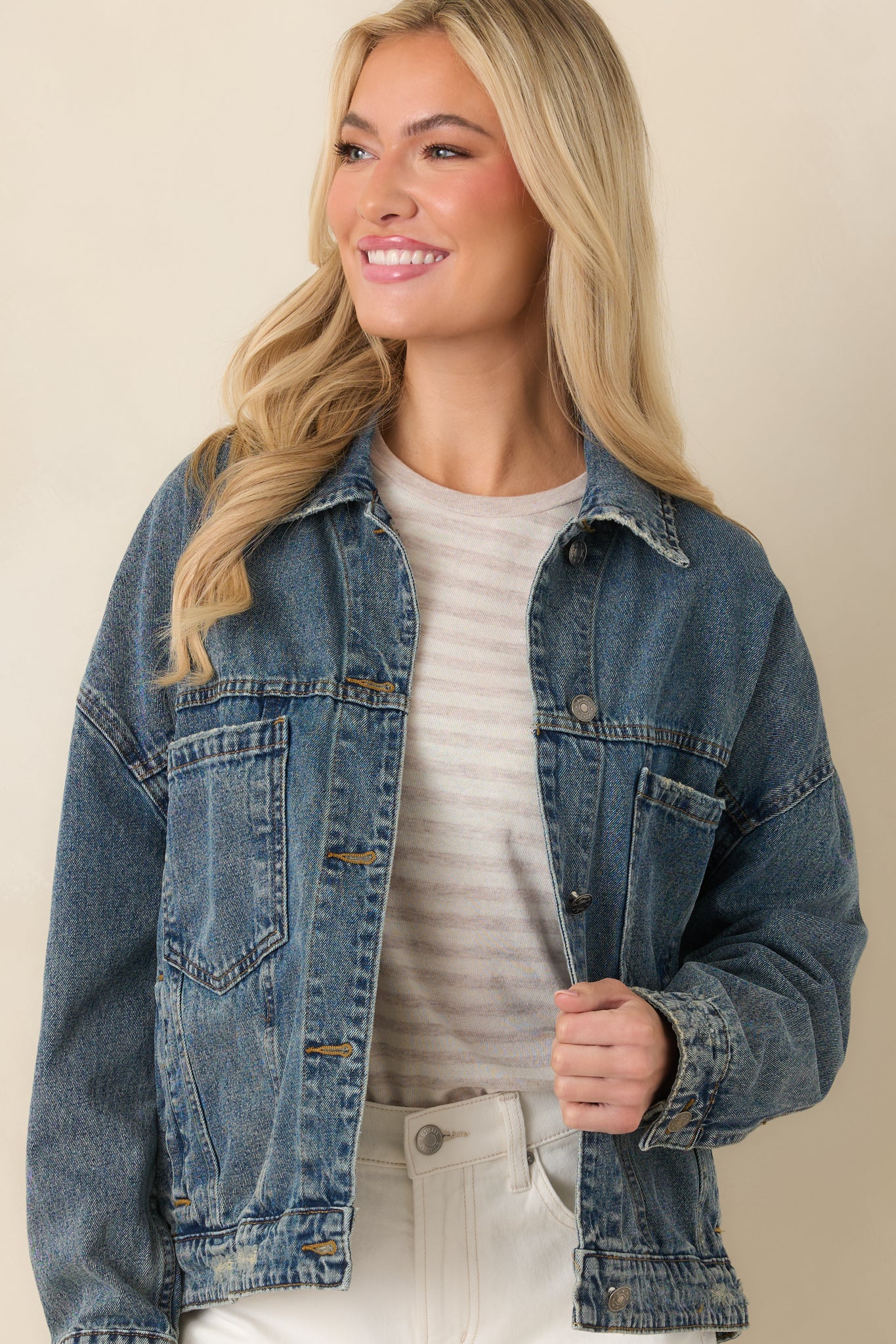 Cropped image highlighting the chest pockets and vintage-inspired fading on the medium wash denim.