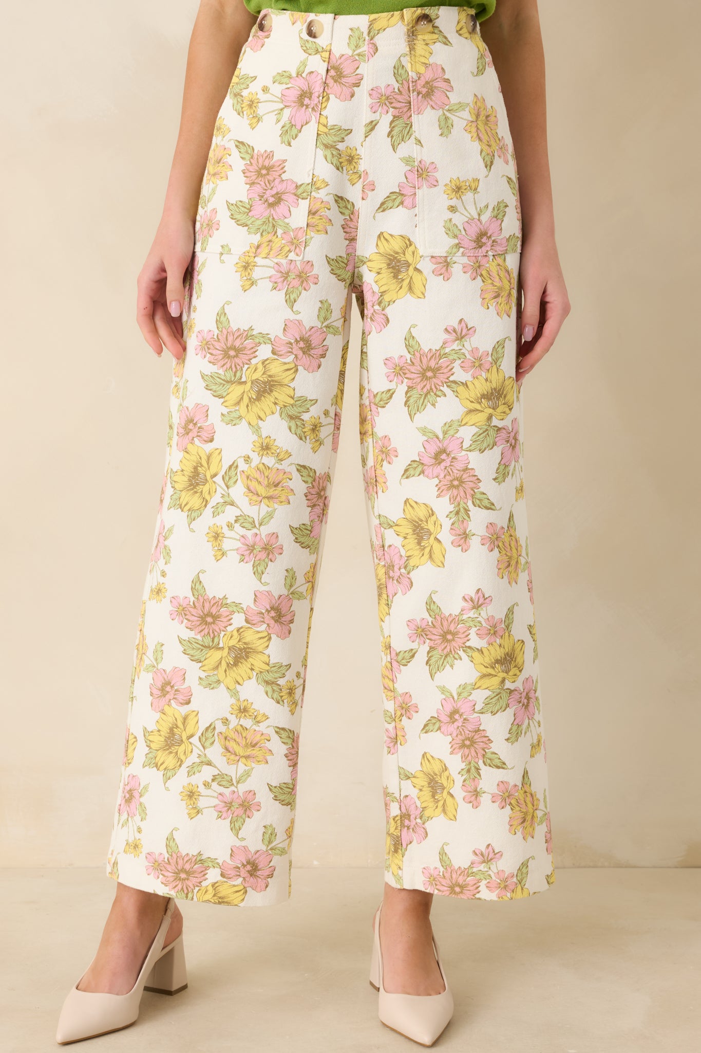 Cropped image highlighting the high-rise waistband and front zipper closure.