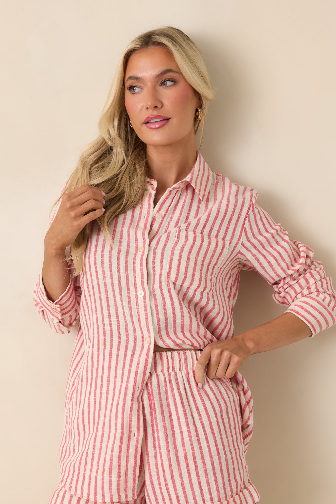 Cropped look at the chest pocket and soft, breathable fabric of the red stripe top