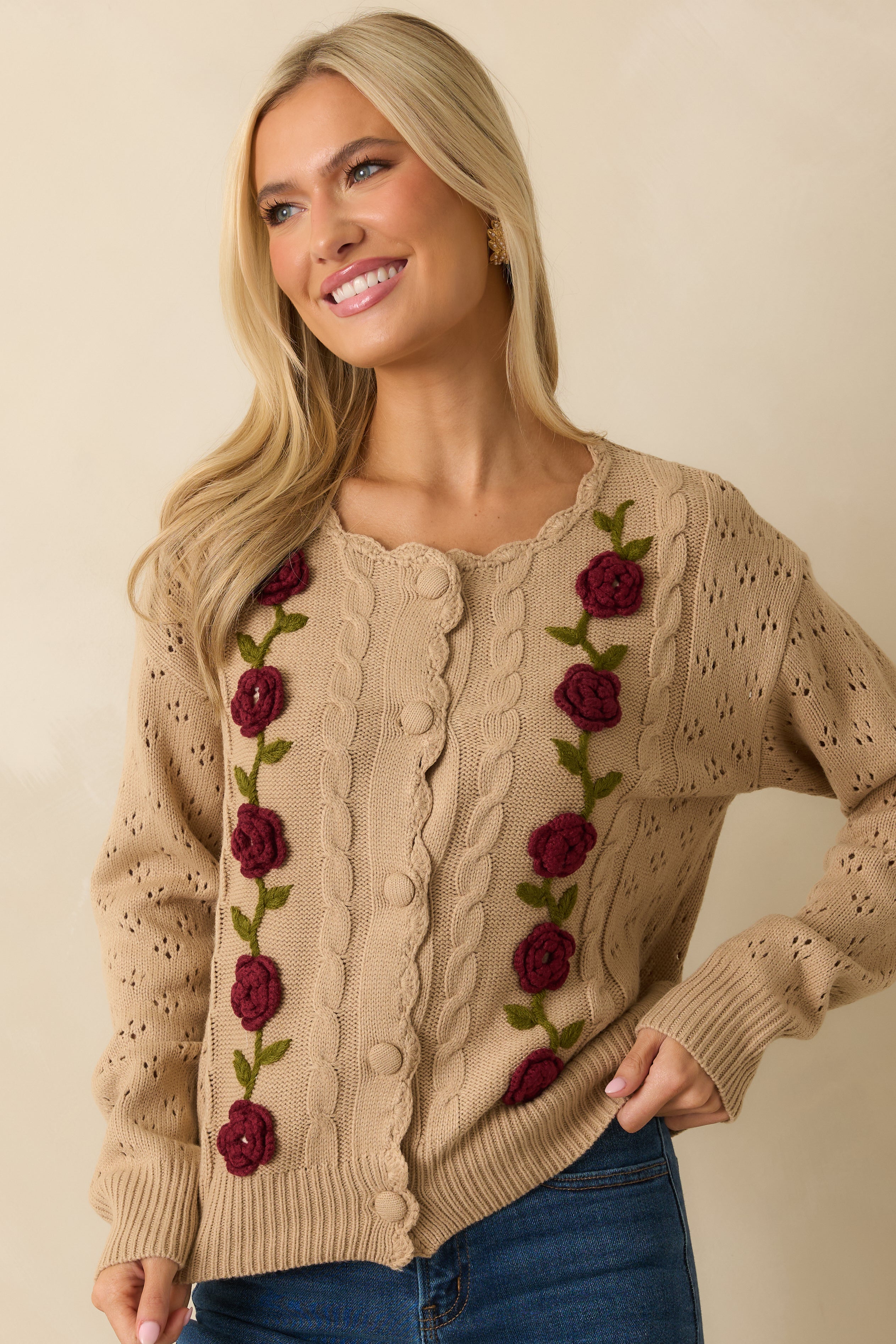 Cropped midsection view emphasizing the floral appliqué detailing along the front.