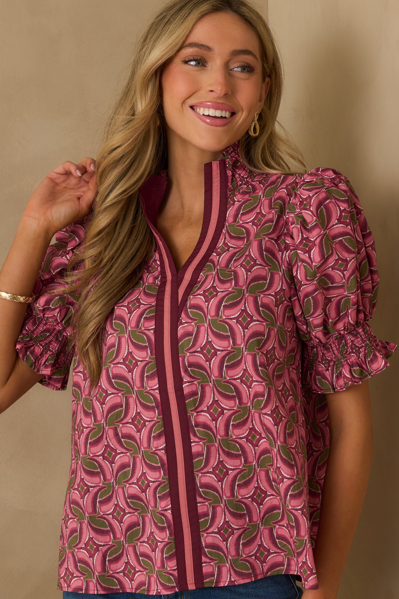 Cropped photo focusing on the contrast trim center seam and ruffle detailing along the front.