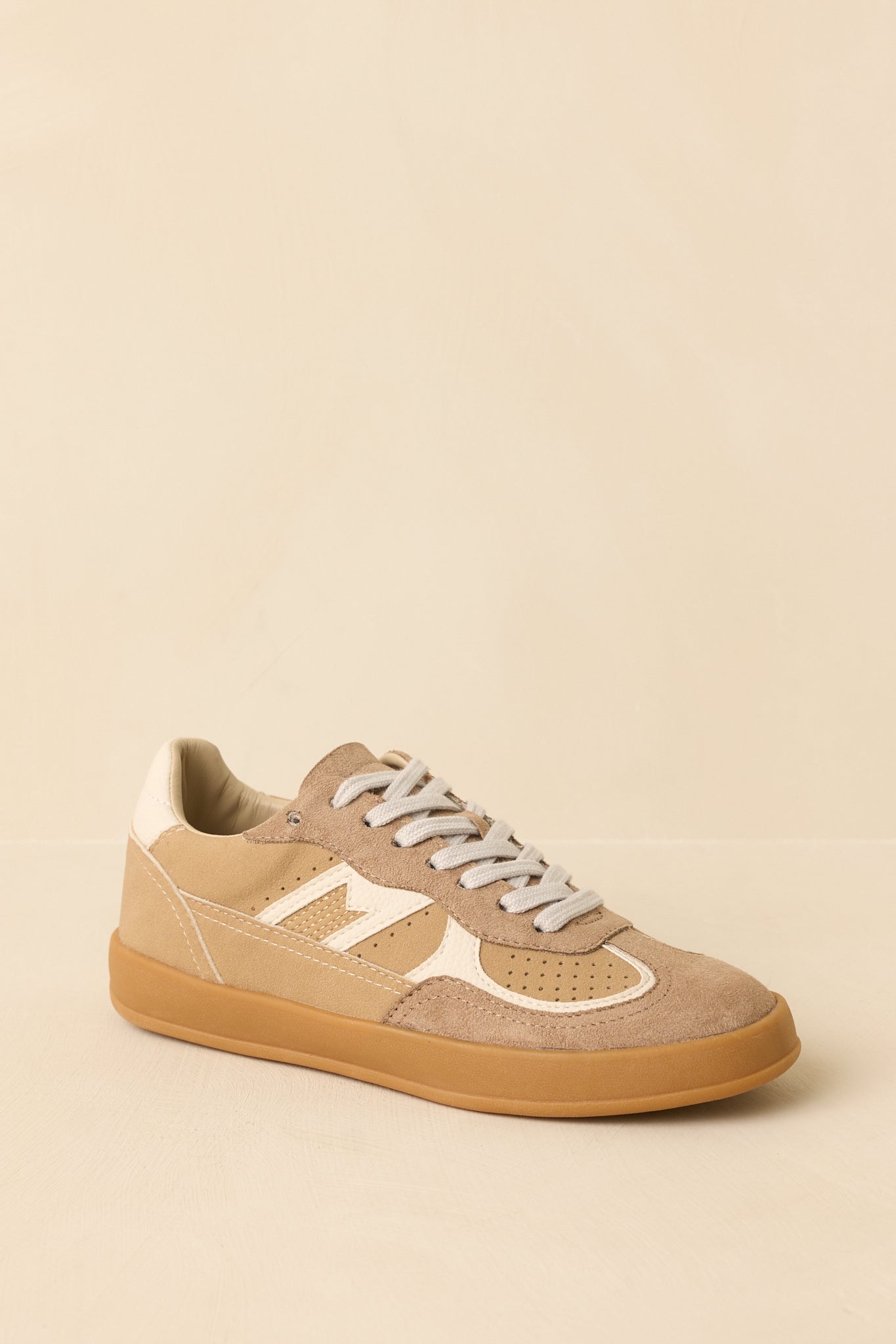 Cropped view focusing on the textured suede and smooth faux leather contrast on the sneaker upper.