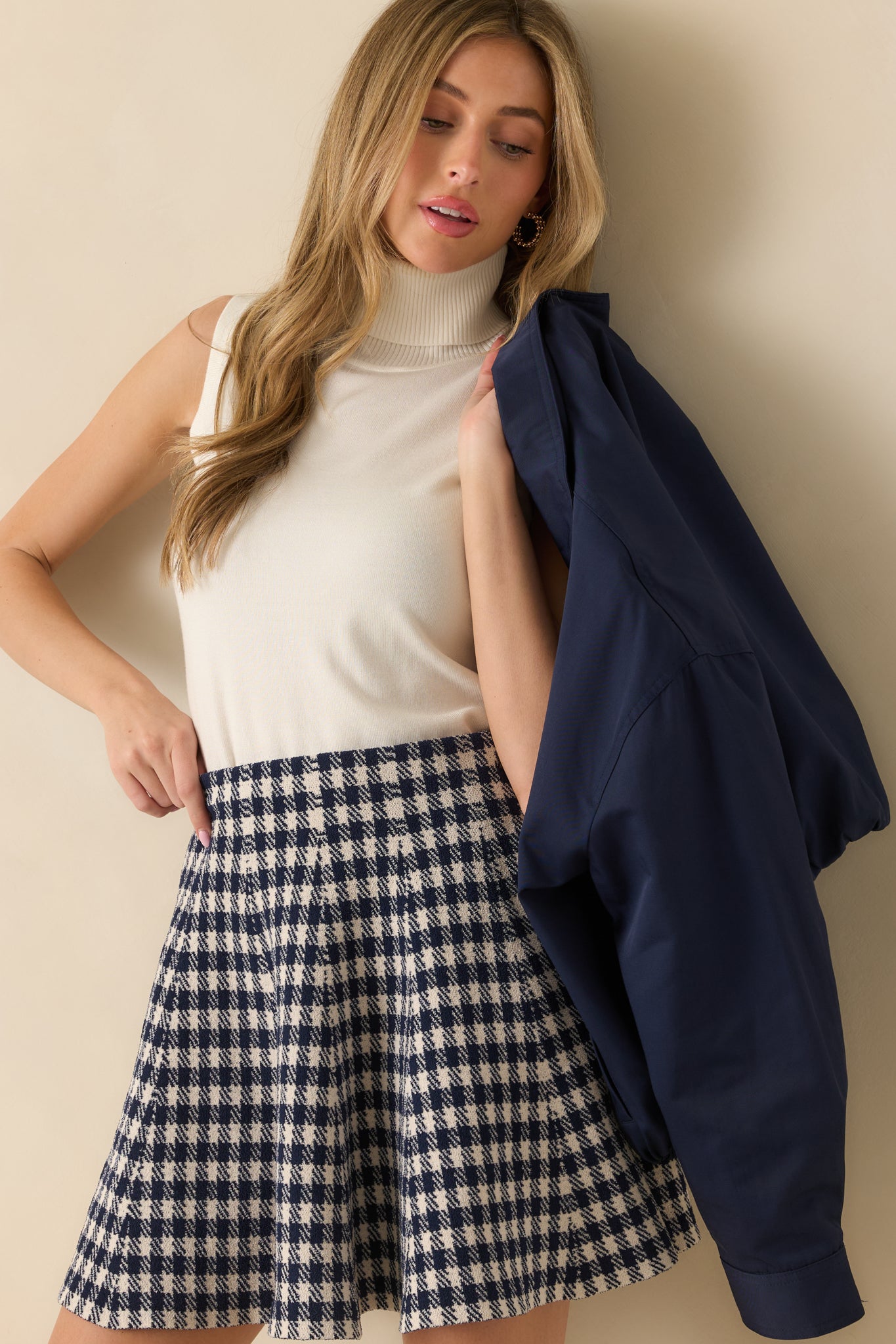 Cropped upper torso view emphasizing the neckline roll and subtle ribbed pattern throughout.