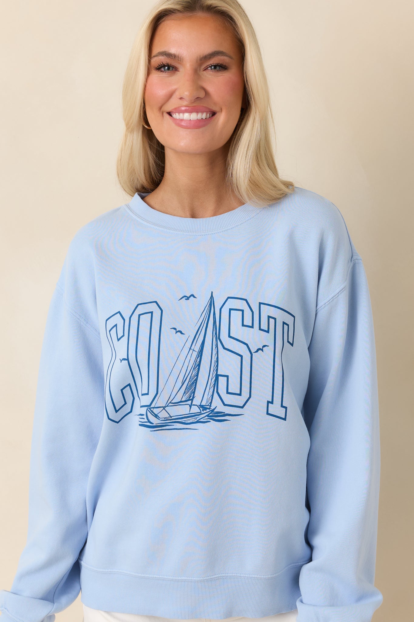 Cropped view focusing on the bold graphic print and light blue fabric texture.