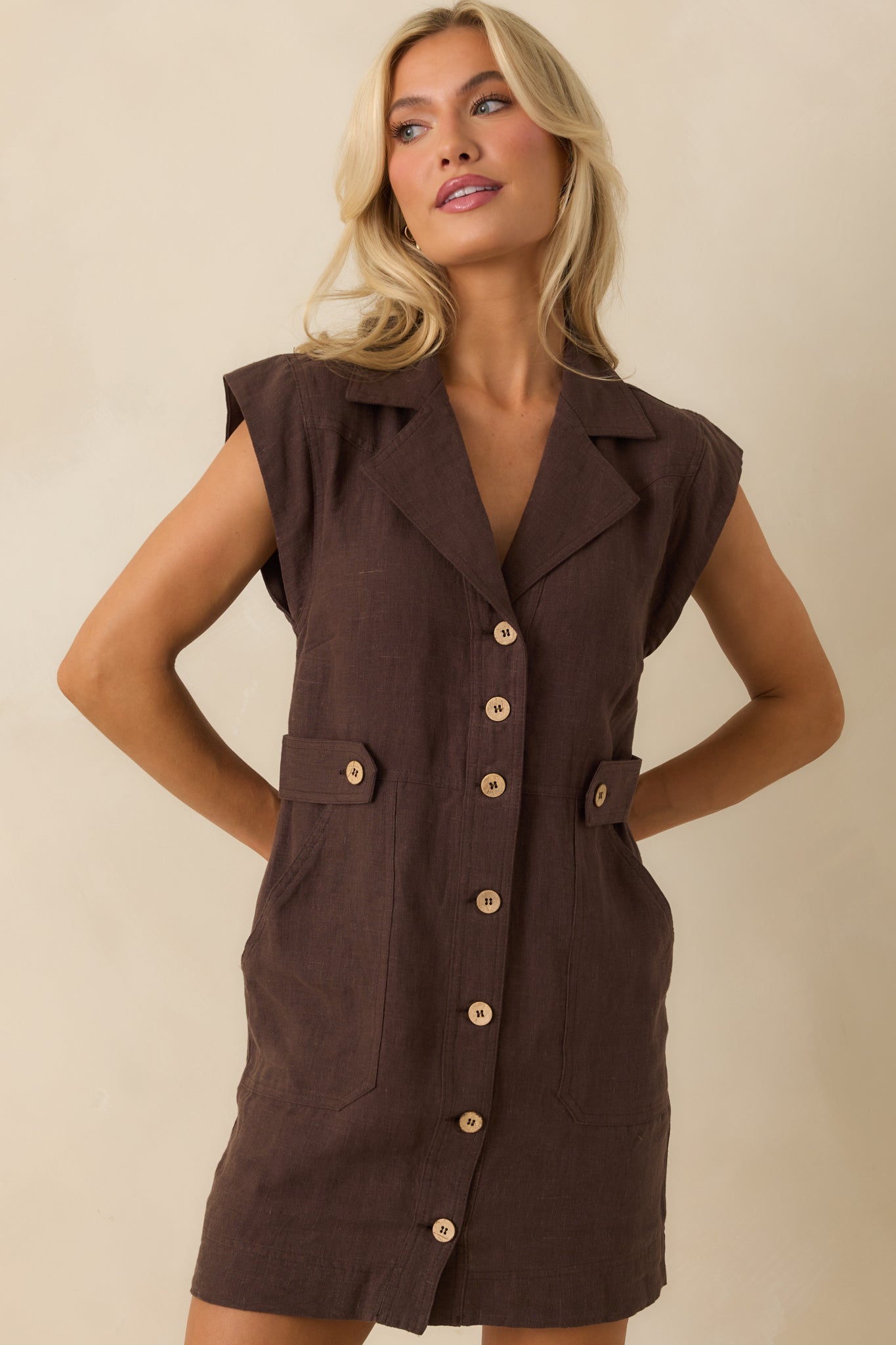 Cropped view of button front and waist area, highlighting lightweight linen drape.