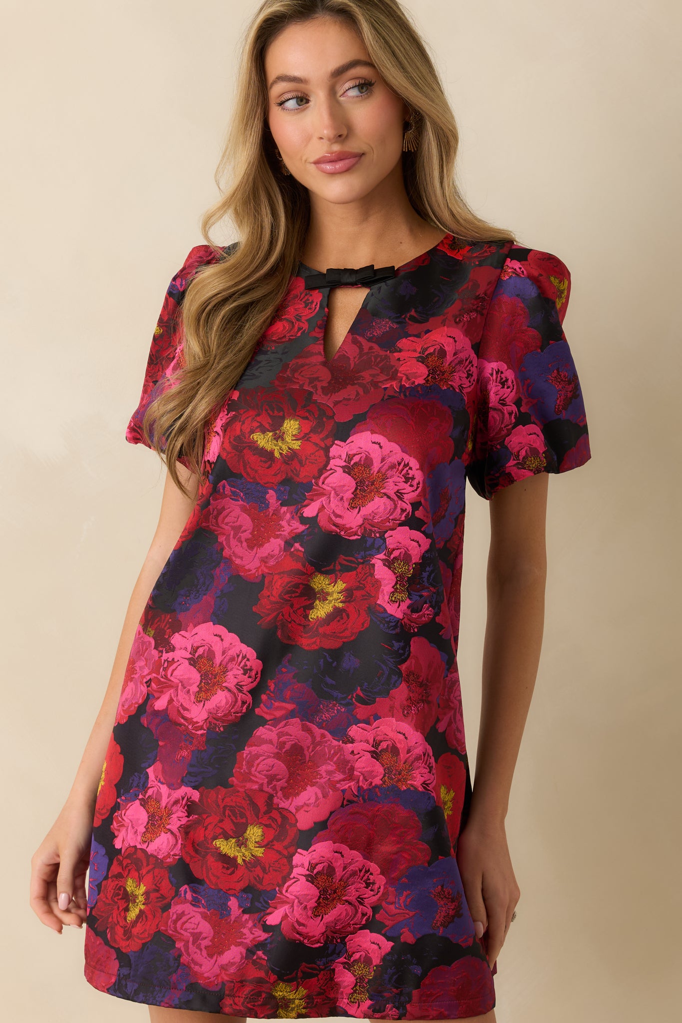 Cropped view highlighting the floral pattern and subtle woven texture of the mini dress.
