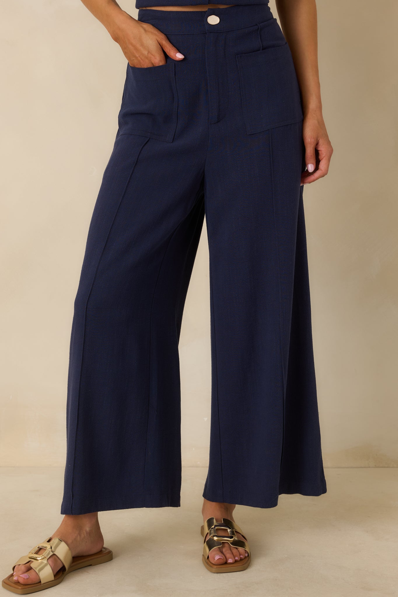Cropped front view focusing on the high-rise waistband and smooth front seam construction.