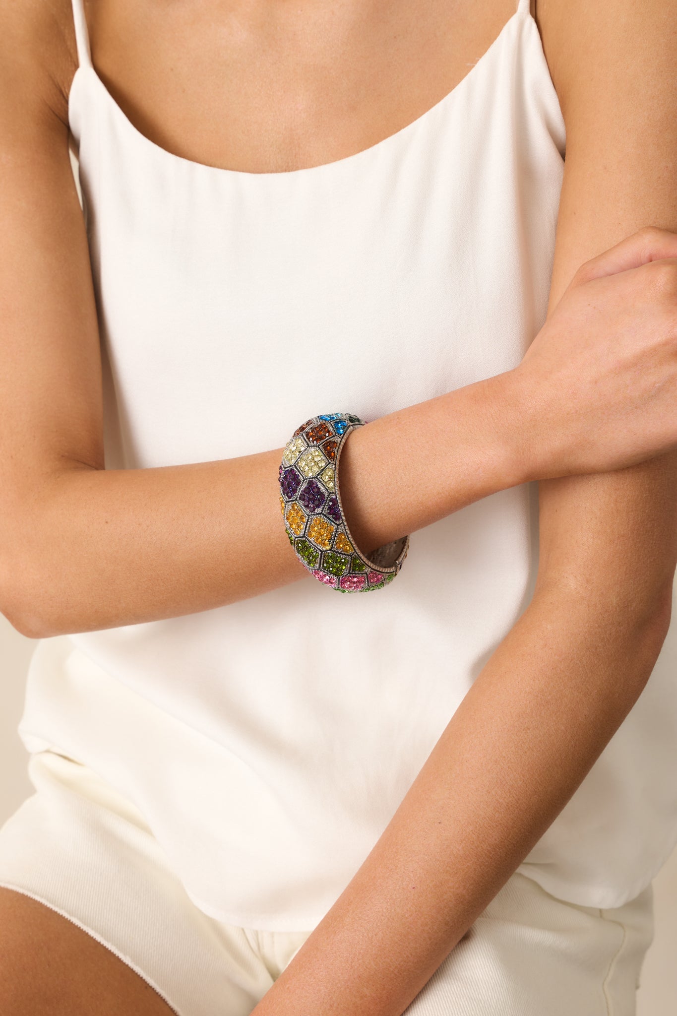 Close-up cropped view of the bracelet’s geometric rhinestone pattern, featuring multicolor stones set against a silver base.