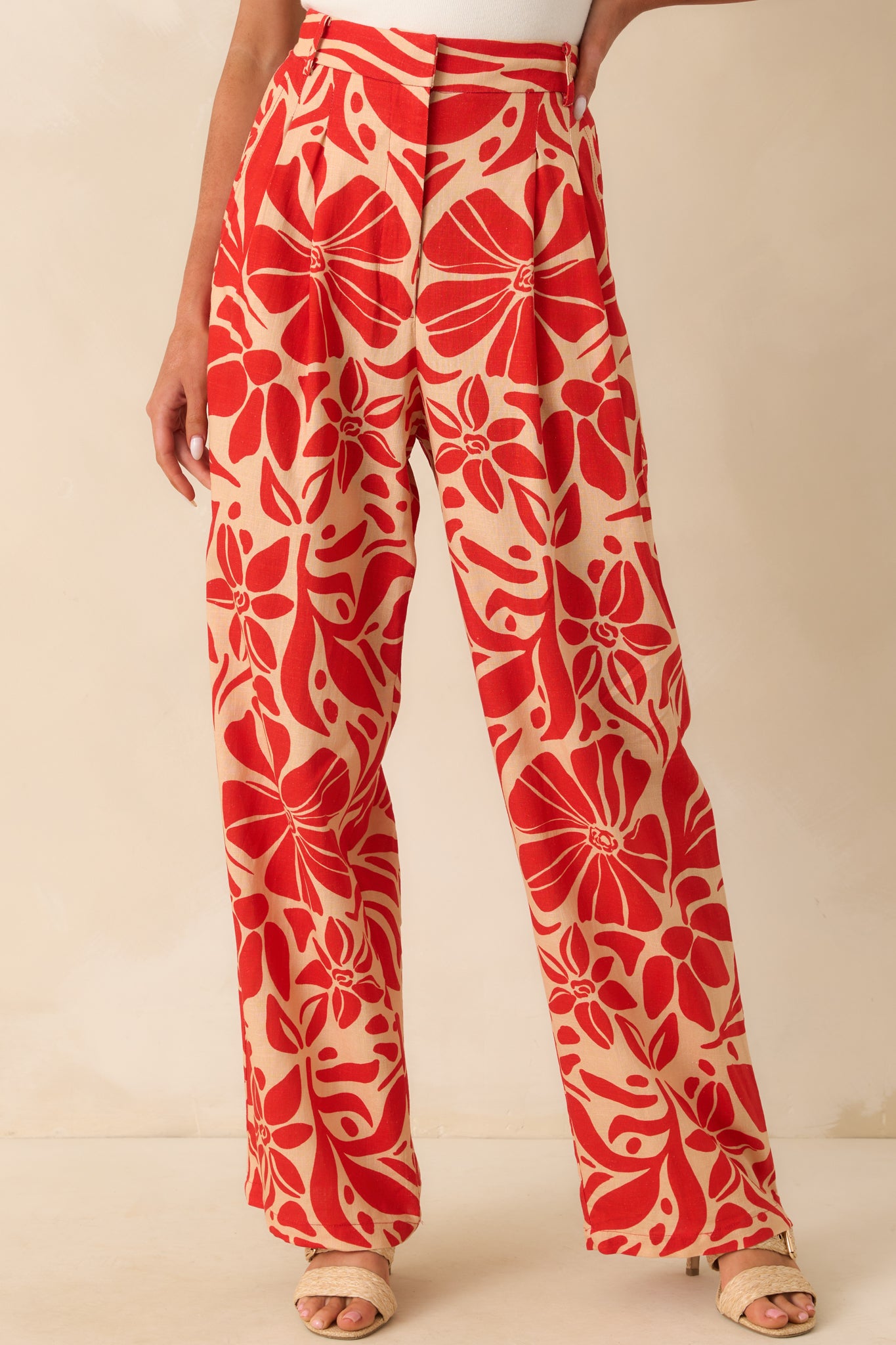 Cropped view of the upper leg showing the floral print and smooth drape of the fabric.
