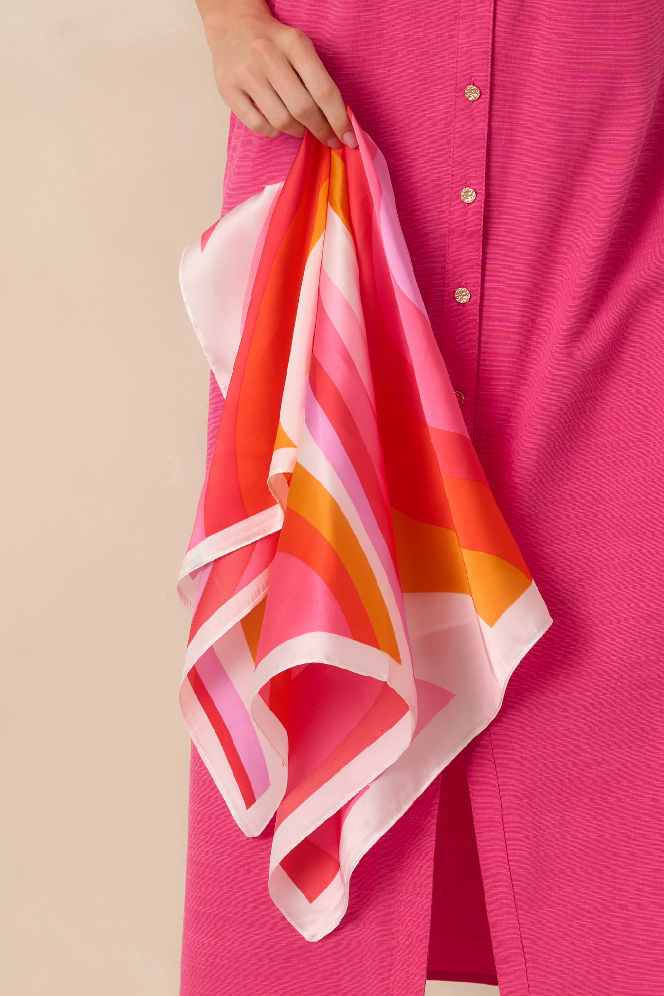 Cropped view of the pink multi retro stripe pattern on the hair scarf, highlighting the smooth, lightweight fabric texture.
