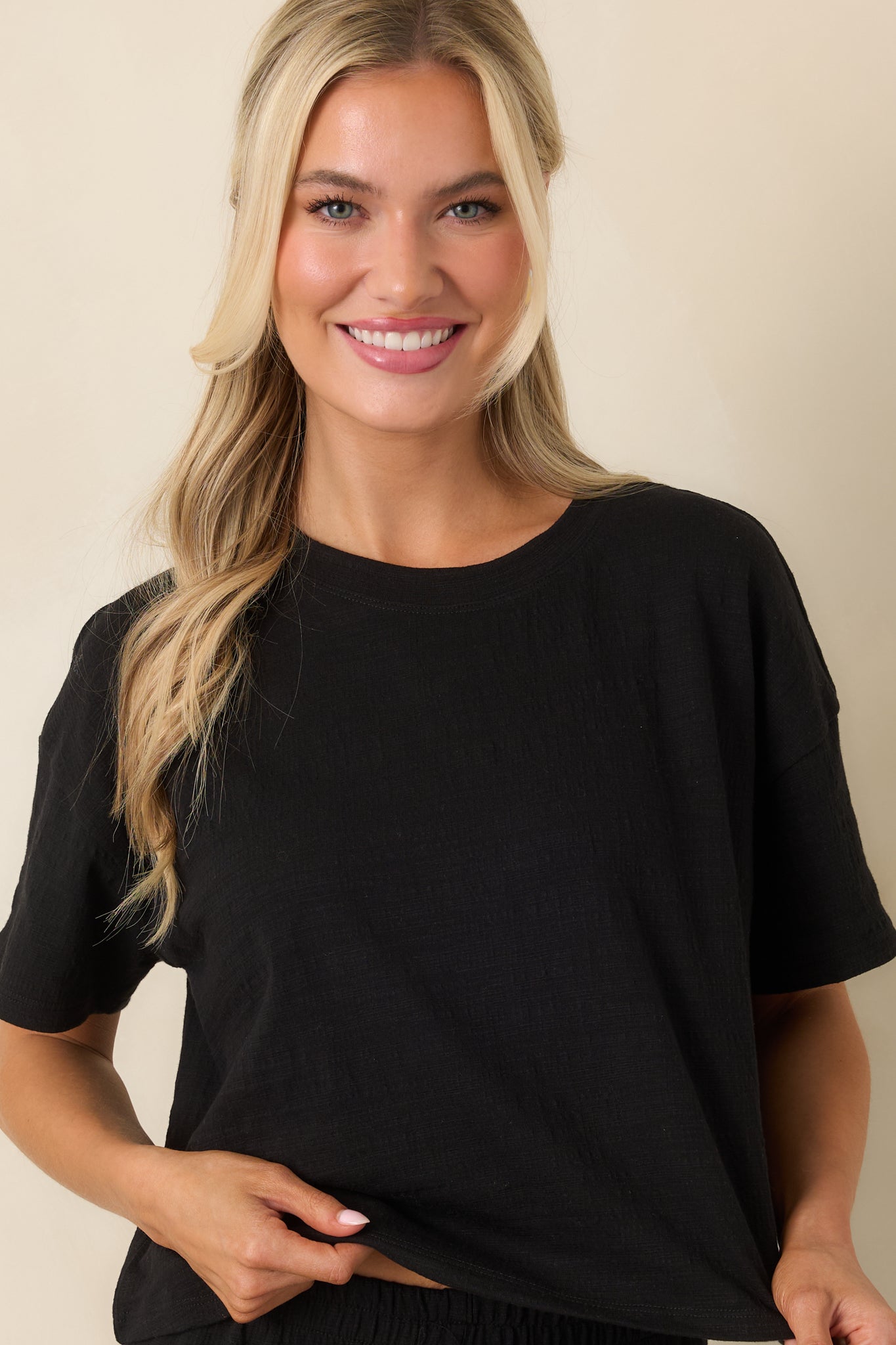 Cropped front view of top showcasing the boxy silhouette and clean hemline.