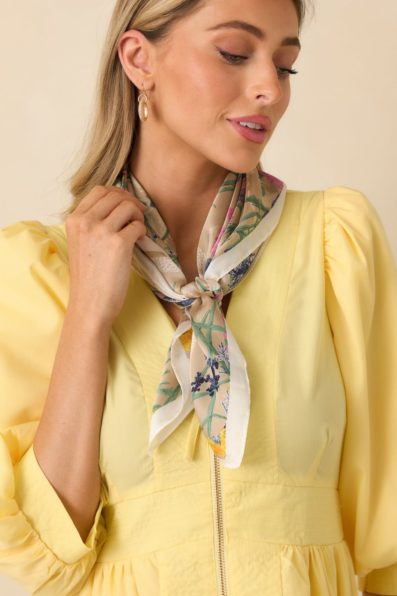 Cropped view of the scarf highlighting the multicolor floral pattern and animal print border.