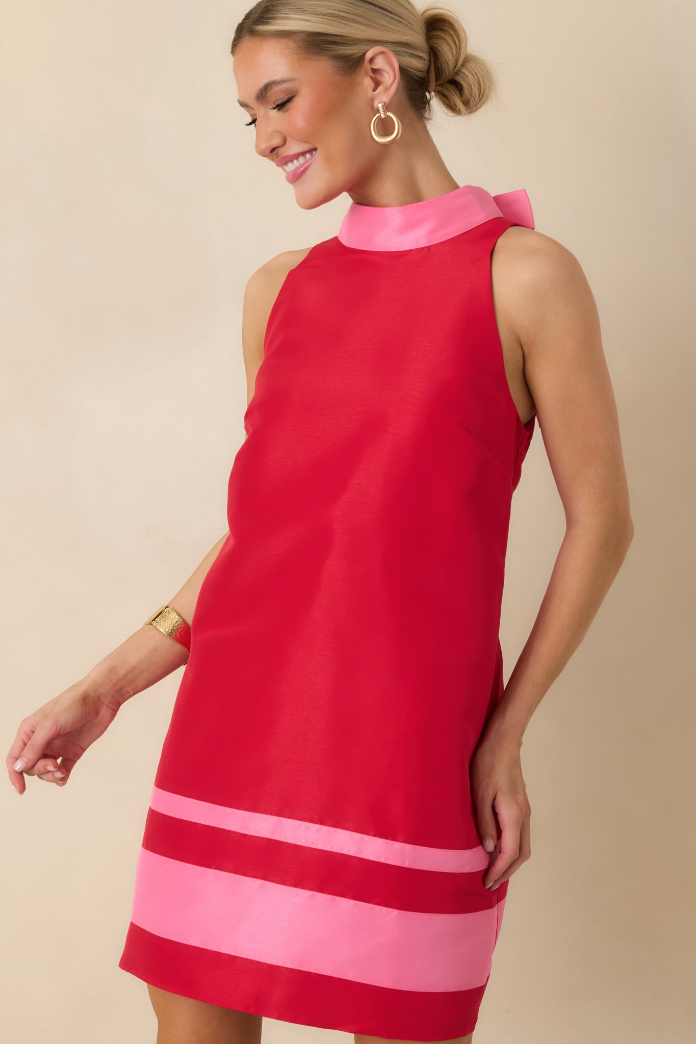 Cropped view showing the clean shift silhouette and smooth woven fabric texture.