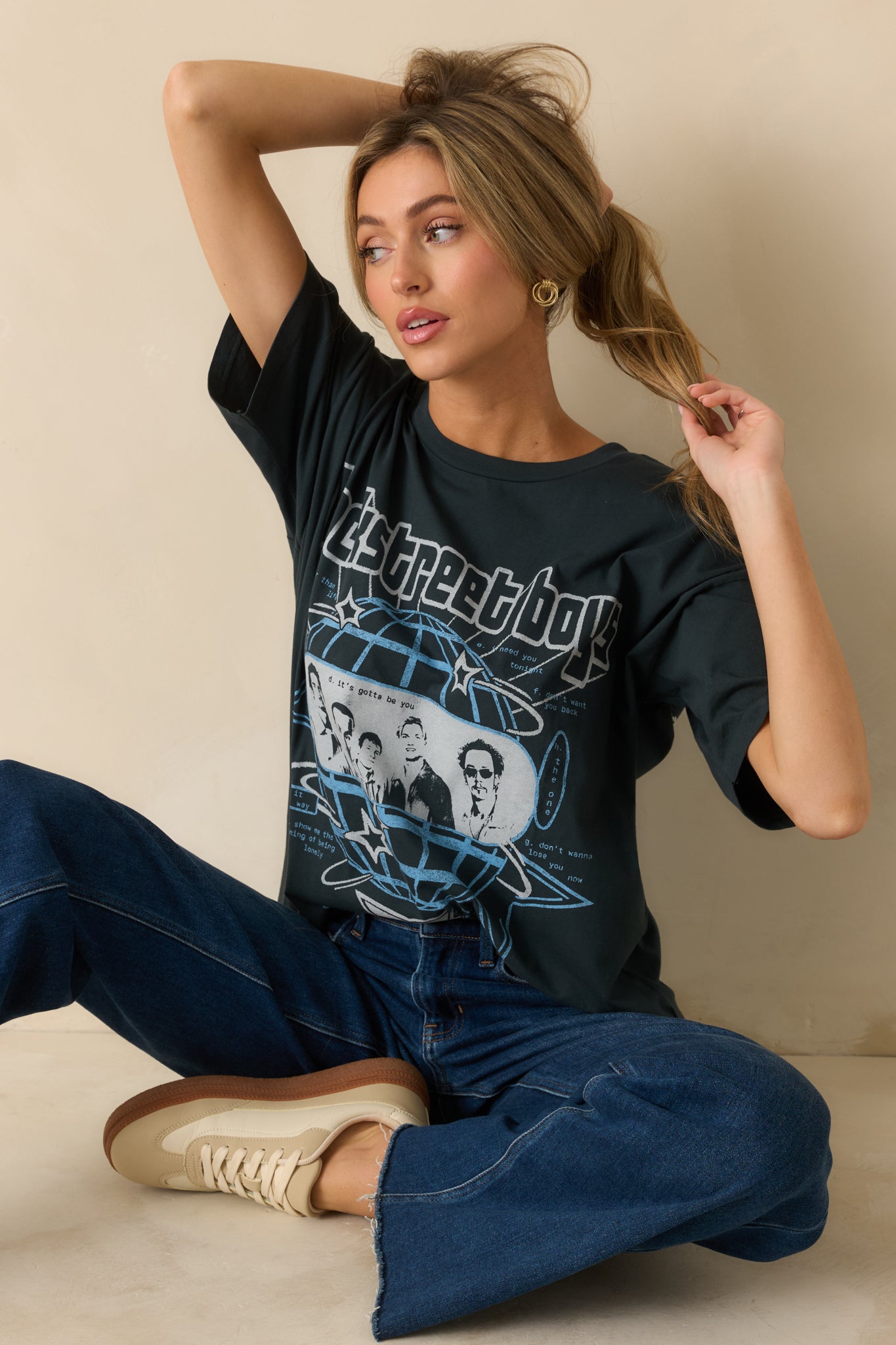 Cropped view showing the vintage band print and soft cotton material.