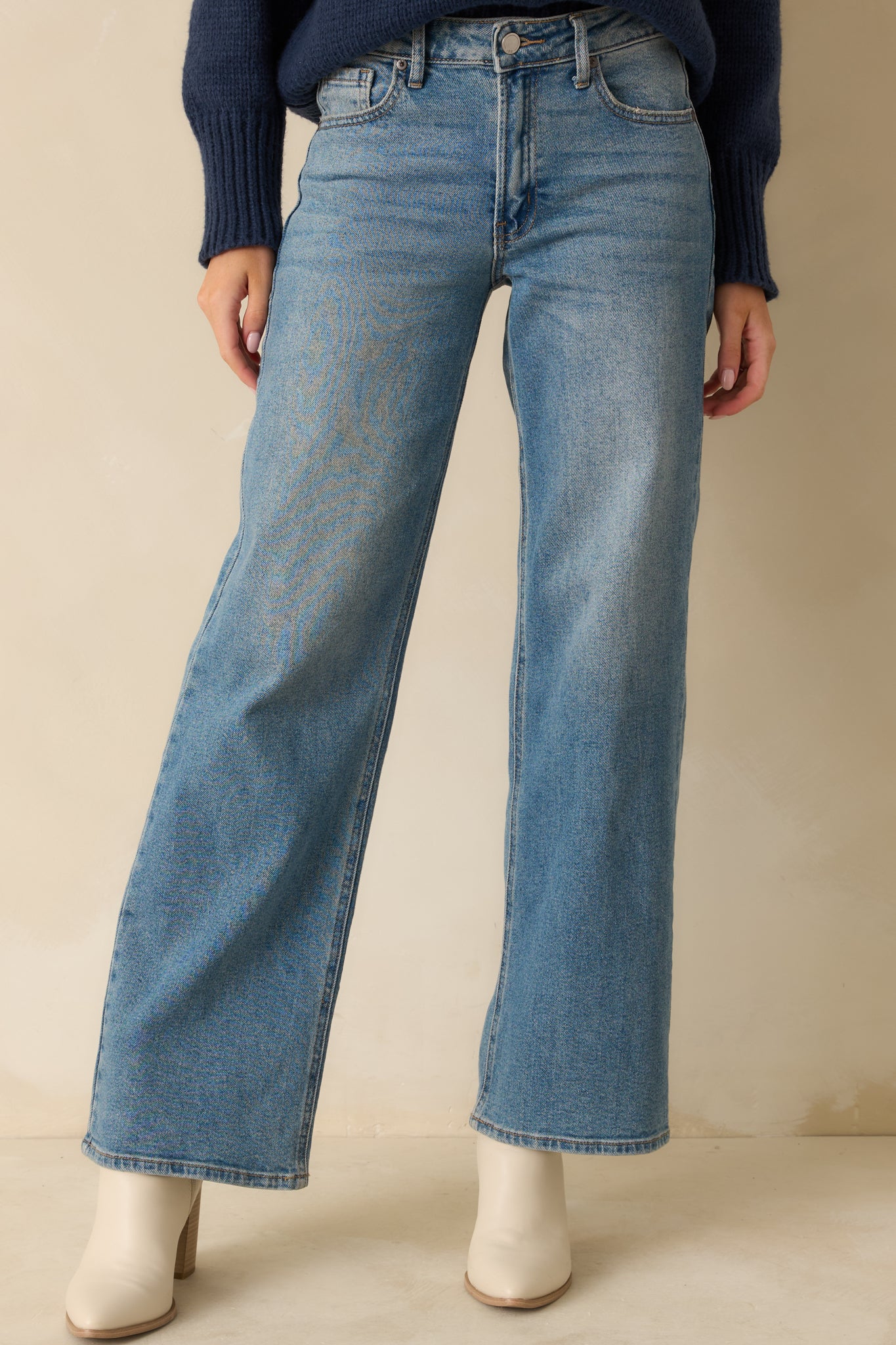 Cropped view focusing on the waistband, belt loops, and top portion of the jeans.