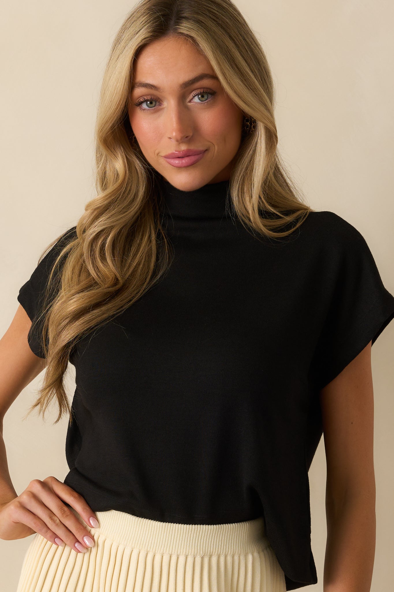 A cropped waist-up view highlighting the relaxed fit through the torso.