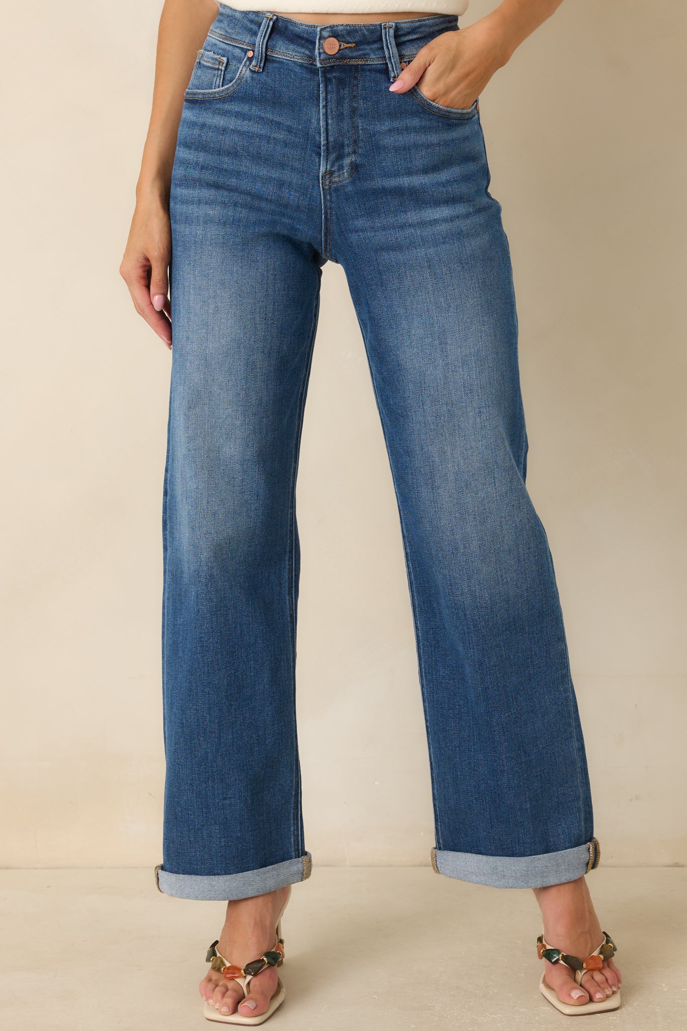 Cuffed hem detail adds a polished touch to these relaxed straight-leg medium wash jeans.