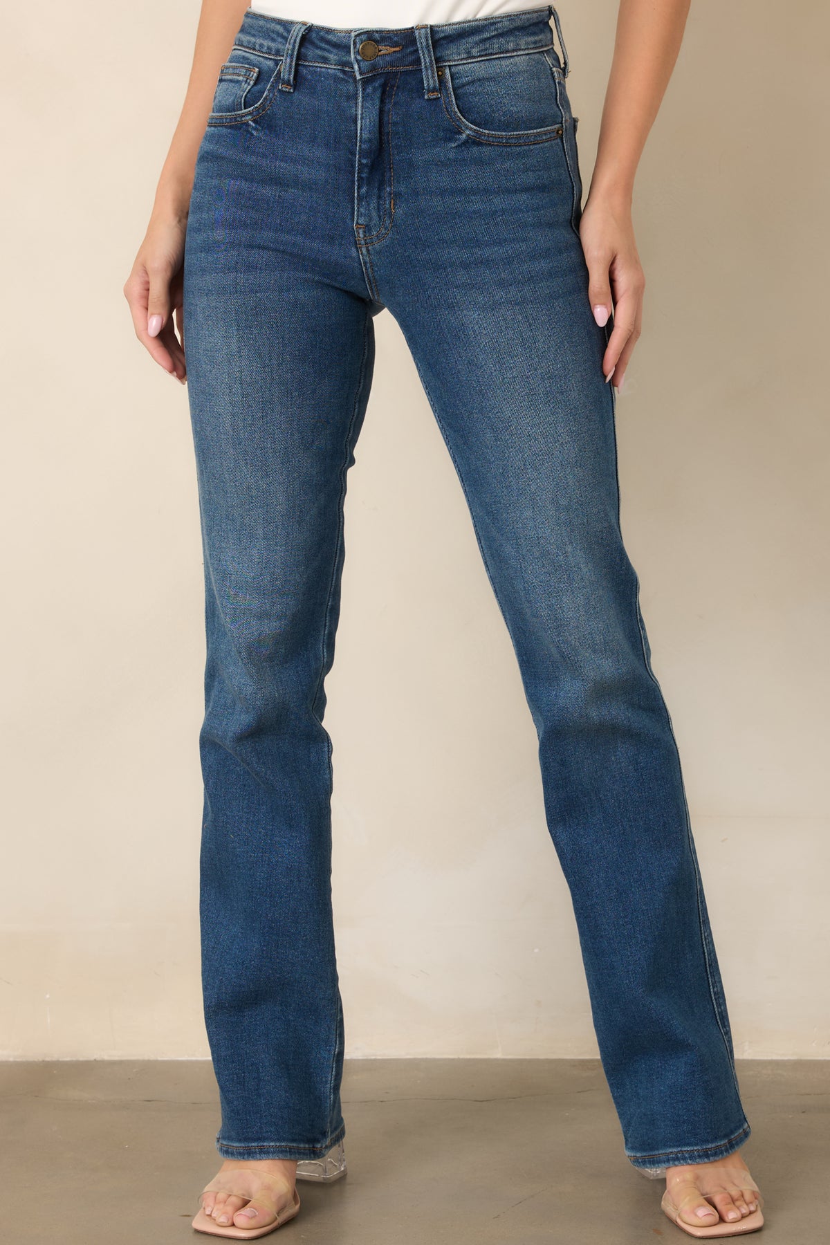 Detailed view of the jeans’ deep indigo denim, showcasing soft fading and whiskering across the upper portion.