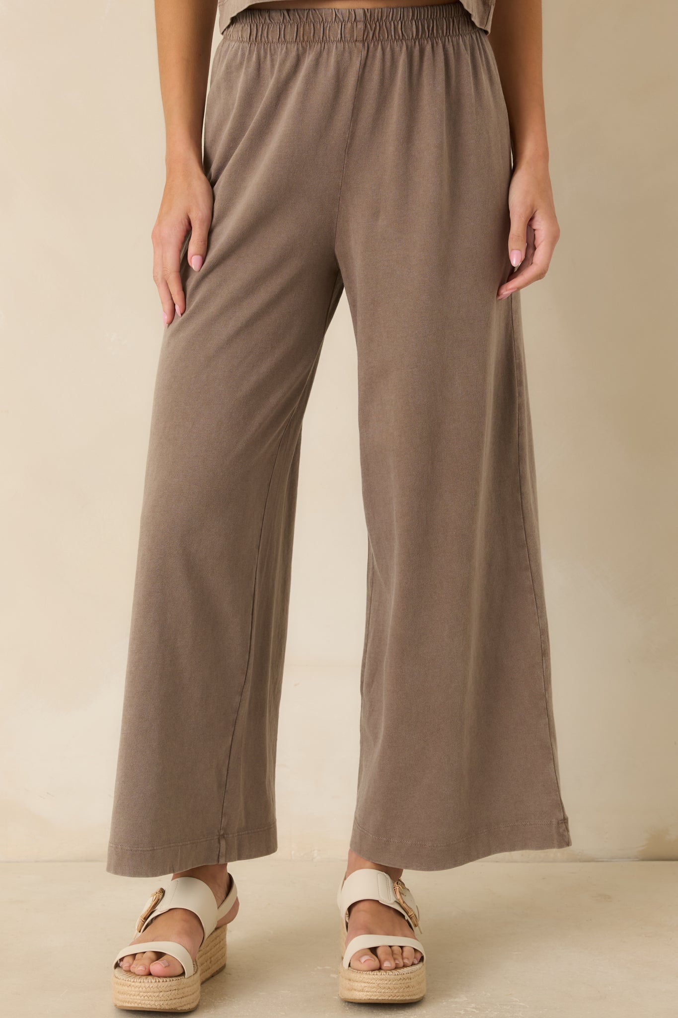 Dark taupe jersey pants featuring a comfortable pull-on design and effortless relaxed fit.
