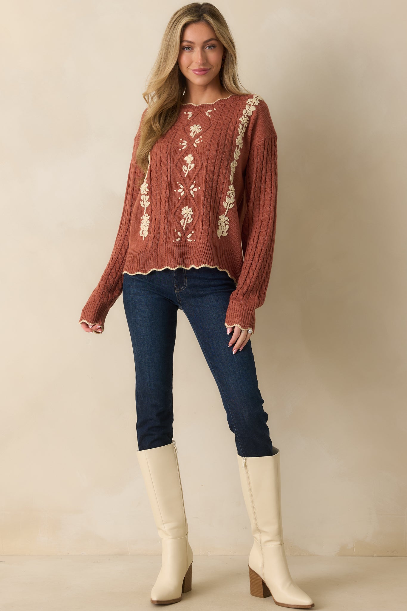 Full body front view of the dark wash jeans showing high-rise waist, skinny leg silhouette, and tan topstitch detailing.