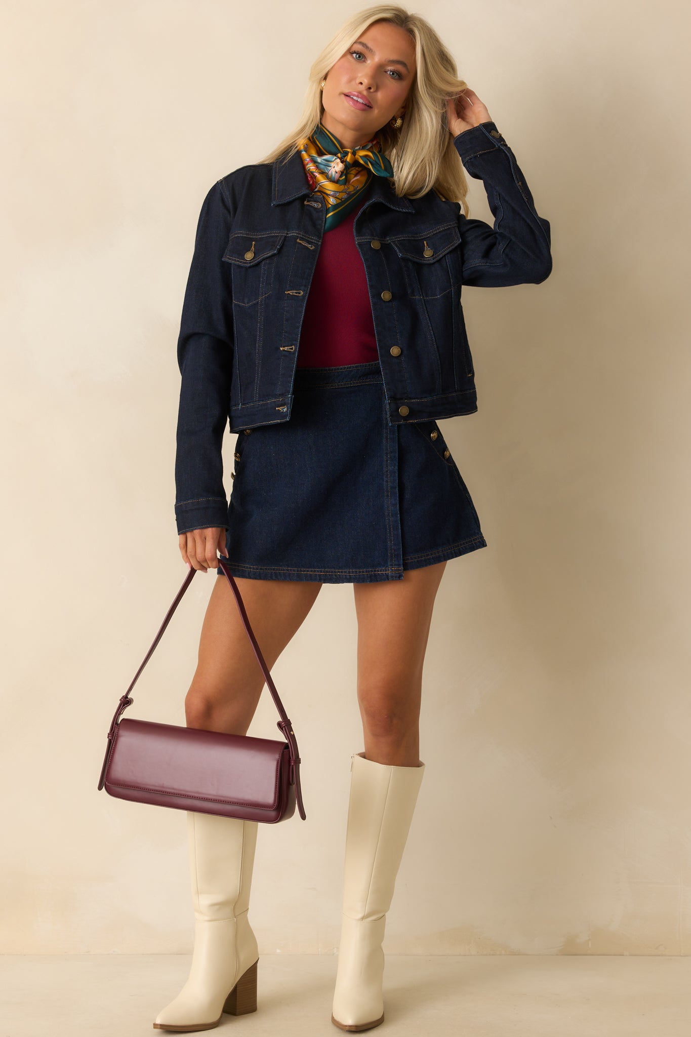 Dark wash wrap-front skort with a hidden button and zipper fly and back shorts silhouette.