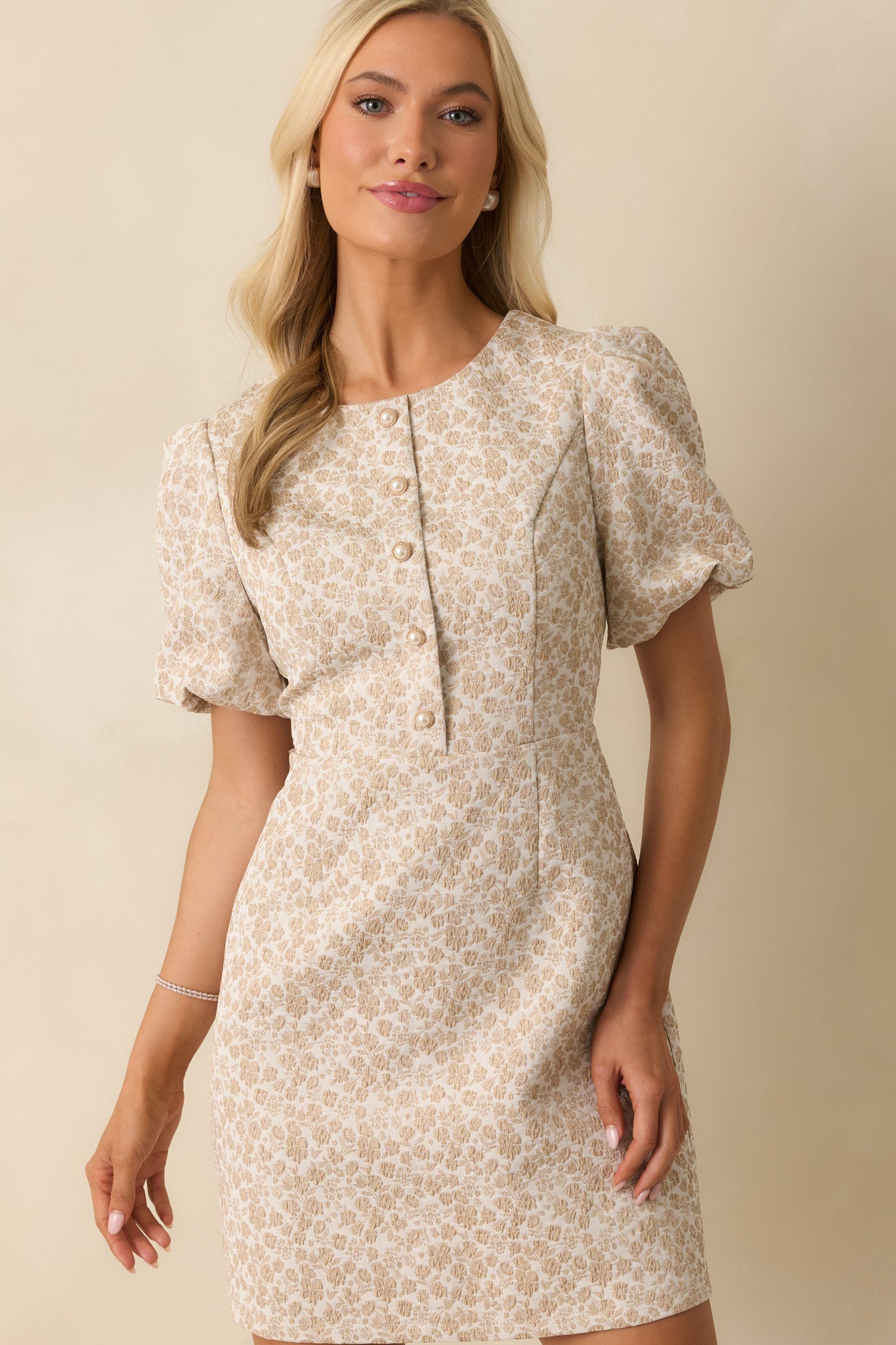 Focus on the darted bodice and textured floral jacquard fabric.