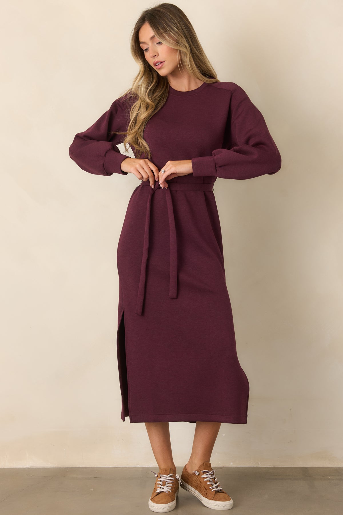 Deep burgundy dress with a clean crew neckline, defined waist tie, and straight midi skirt.