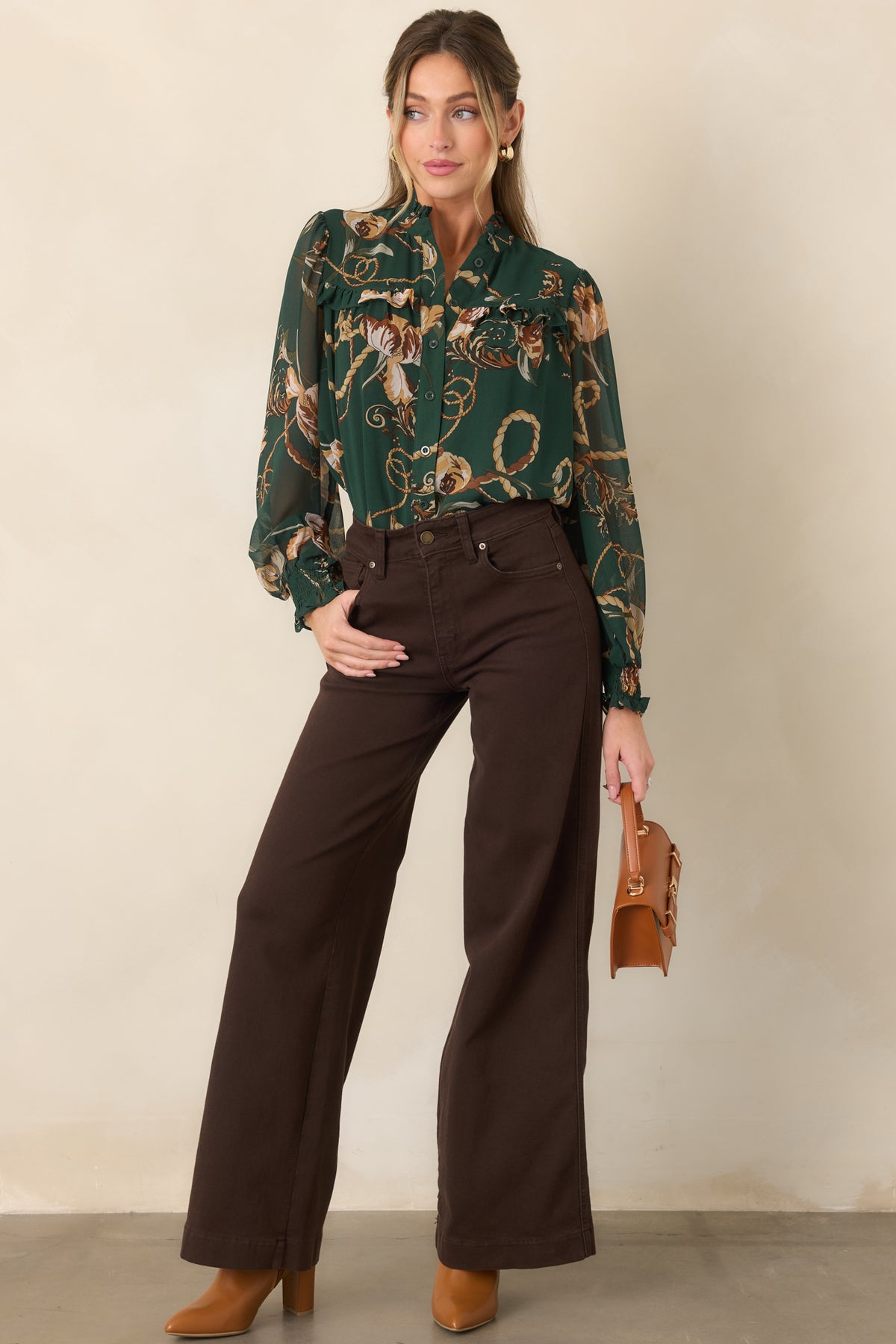 Deep forest green blouse featuring airy sheer sleeves, elasticized smocked cuffs, a ruffled collar, and feminine layered detailing.