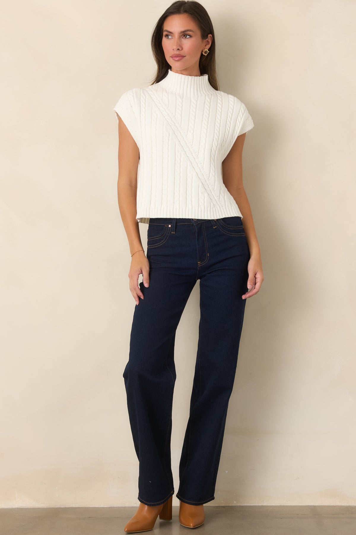 Deep indigo jeans featuring a high-rise waist and full-length wide-leg silhouette.
