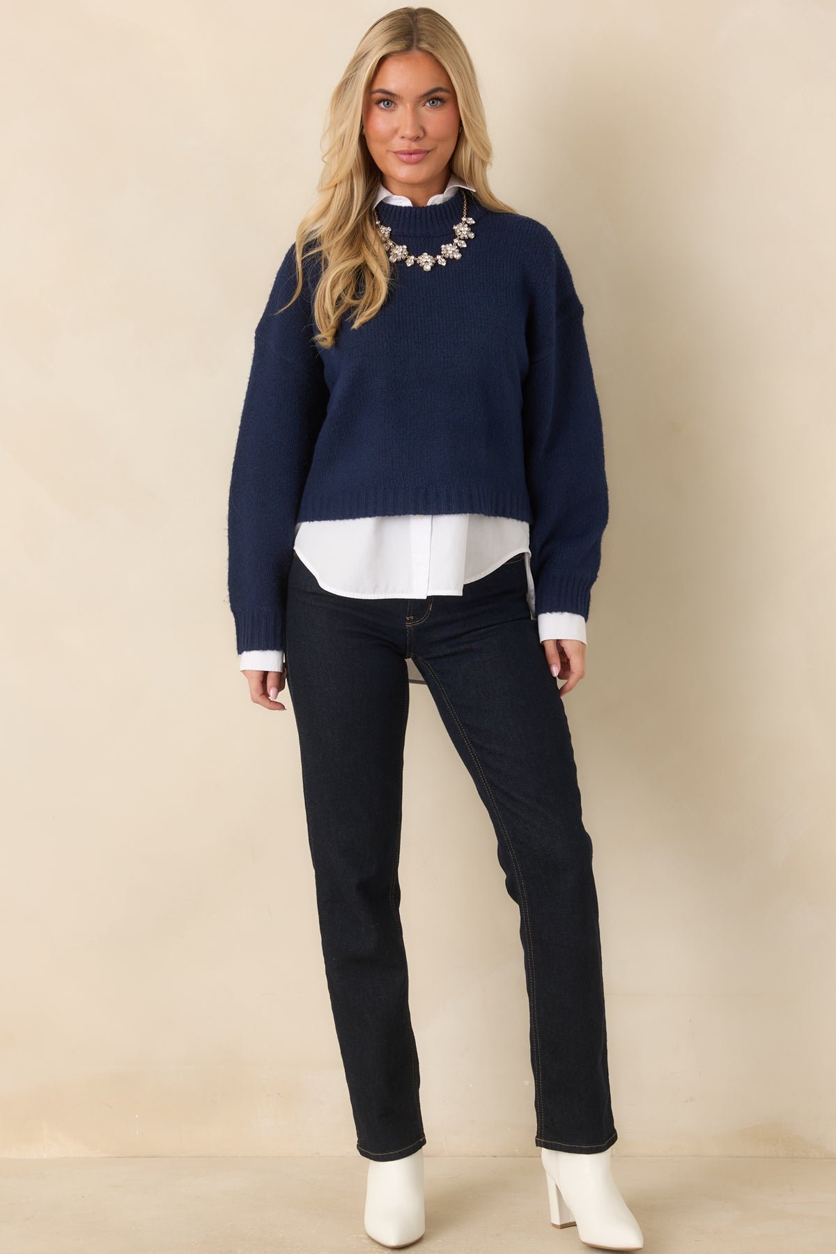 Deep navy knit pullover with a relaxed boxy fit, dropped shoulders, and ribbed trim.