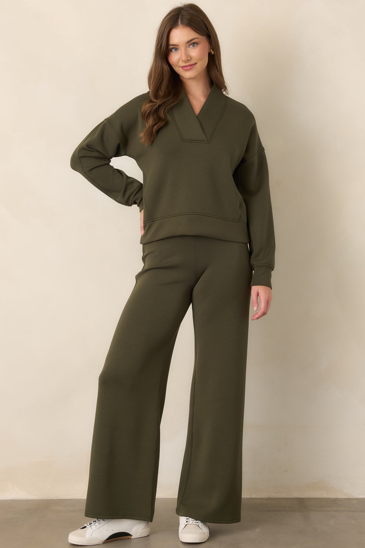 Deep olive top crafted in smooth AirEssentials® fabric with a lightweight drape, comfortable stretch, and polished silhouette.