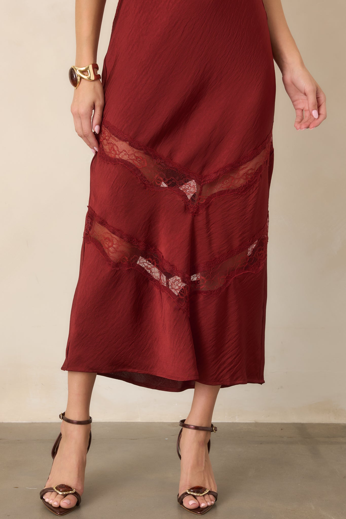 Deep red satin skirt with contrasting tonal lace insets arranged in angled chevron panels