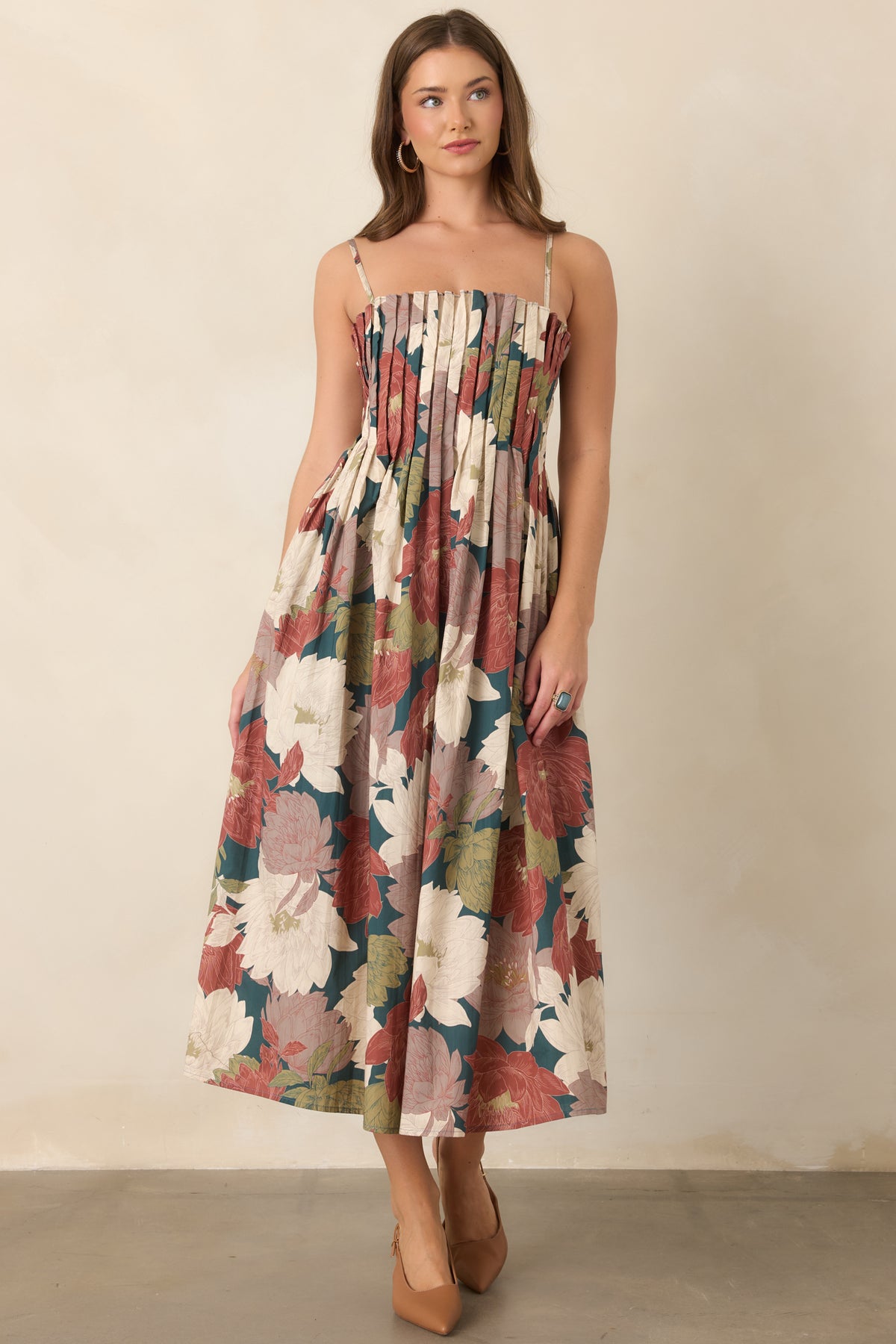 Deep teal cotton midi dress featuring an oversized floral print in burgundy, ivory, dusty mauve, and olive.