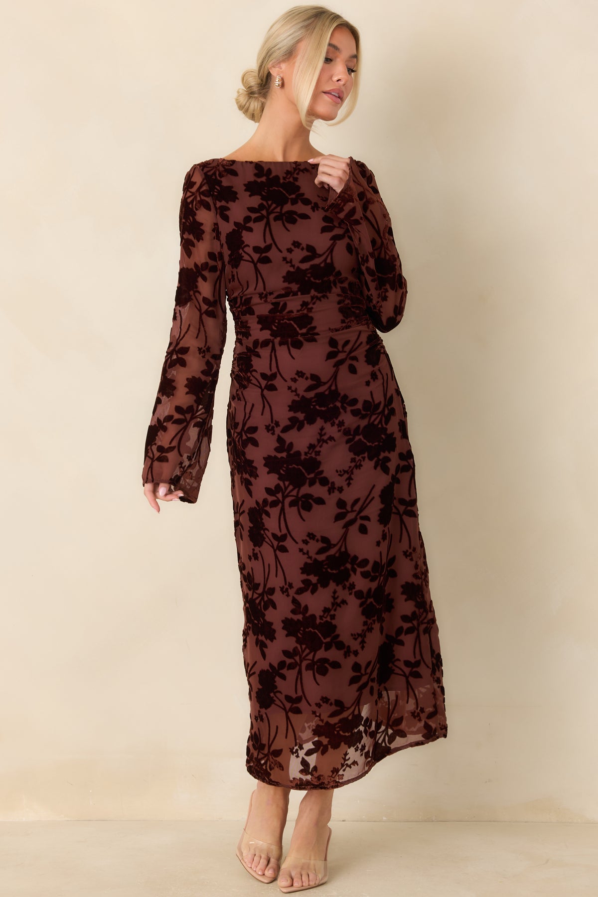 Deep wine floral velvet dress with a boat neckline, sheer long sleeves, and a body-skimming skirt.