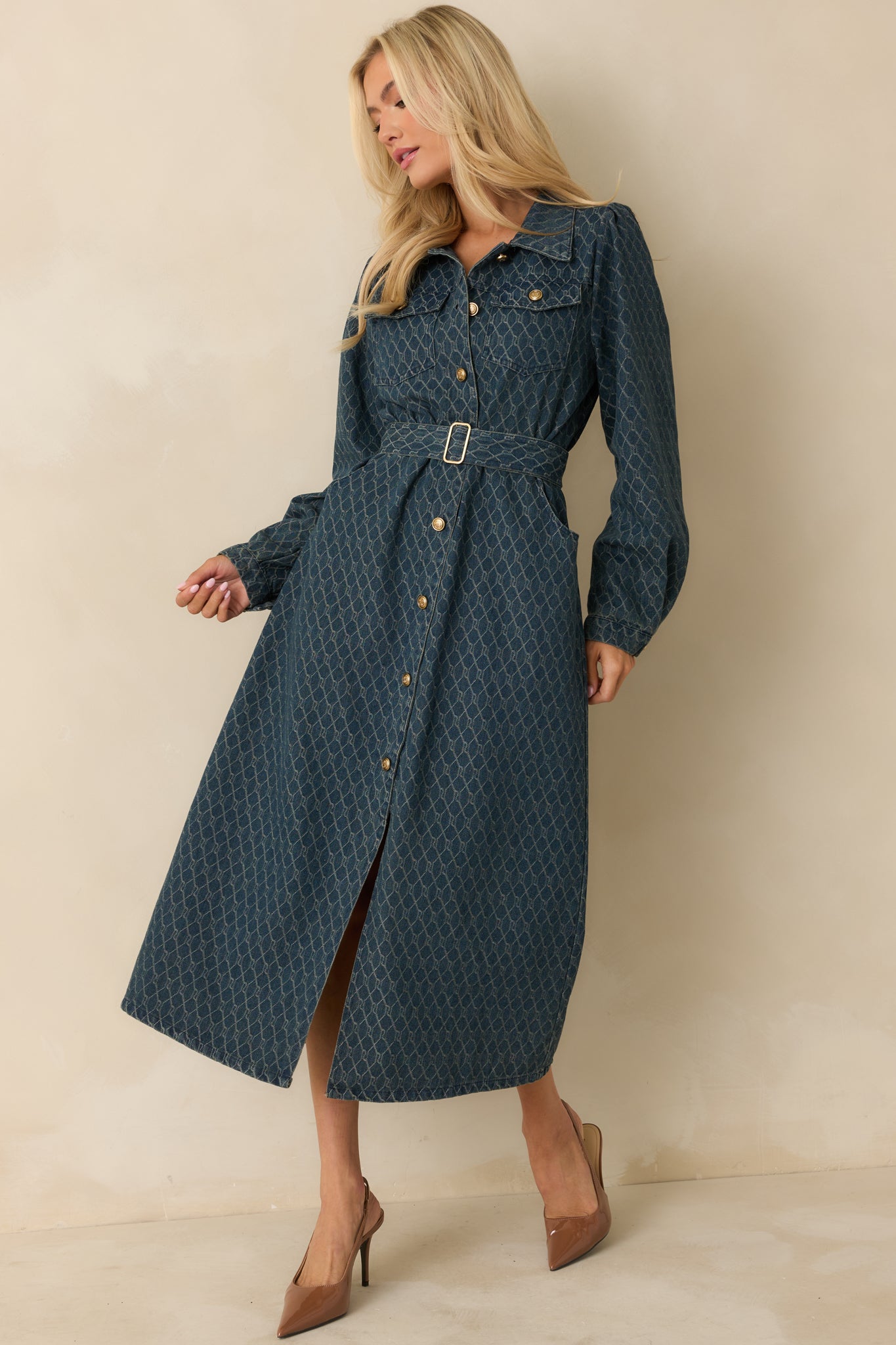 Denim dress with a removable self-tie belt and straight hem creating a defined silhouette.