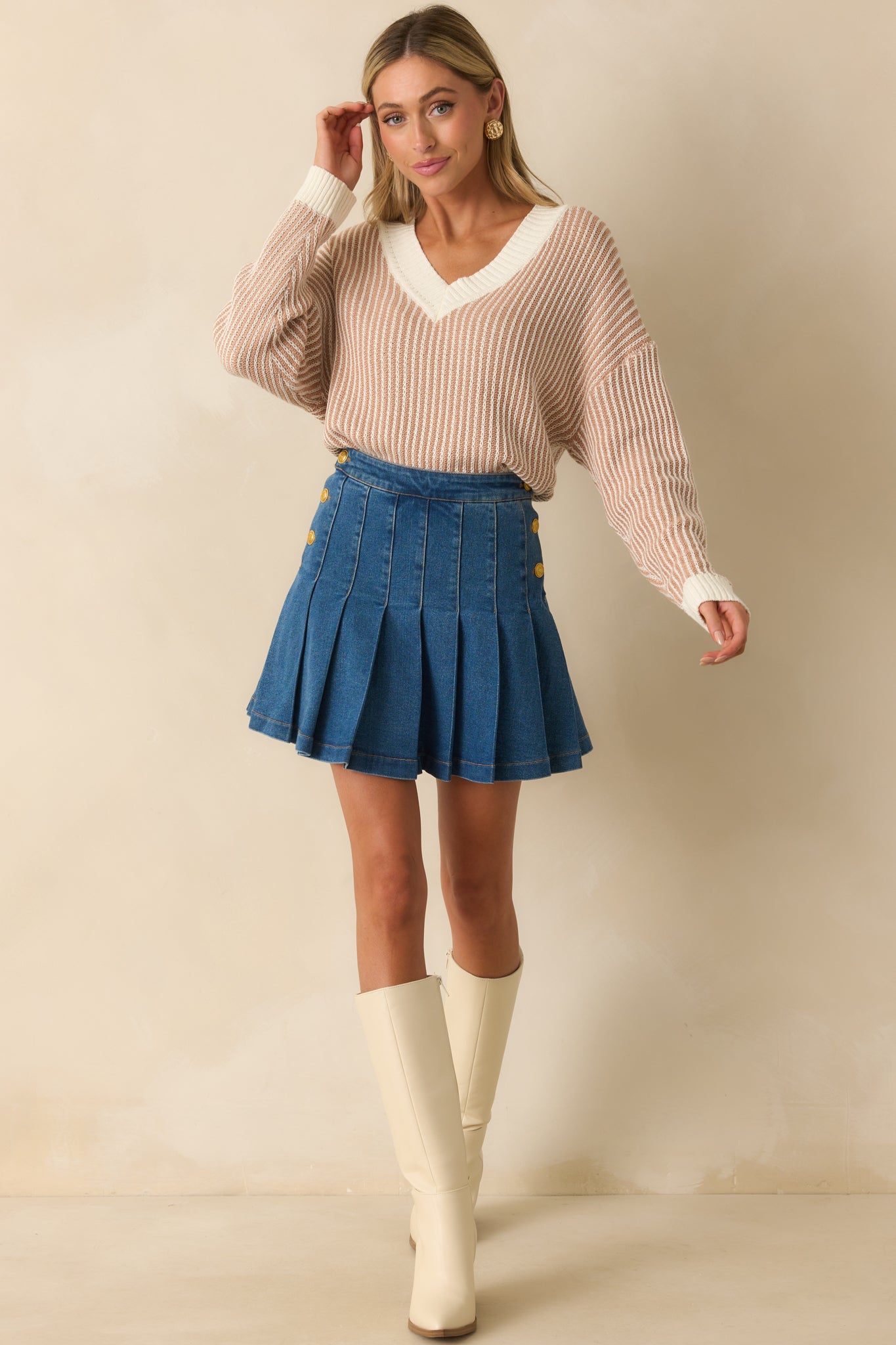 Cotton-blend denim skirt in mini length featuring hidden built-in shorts lining for comfort.