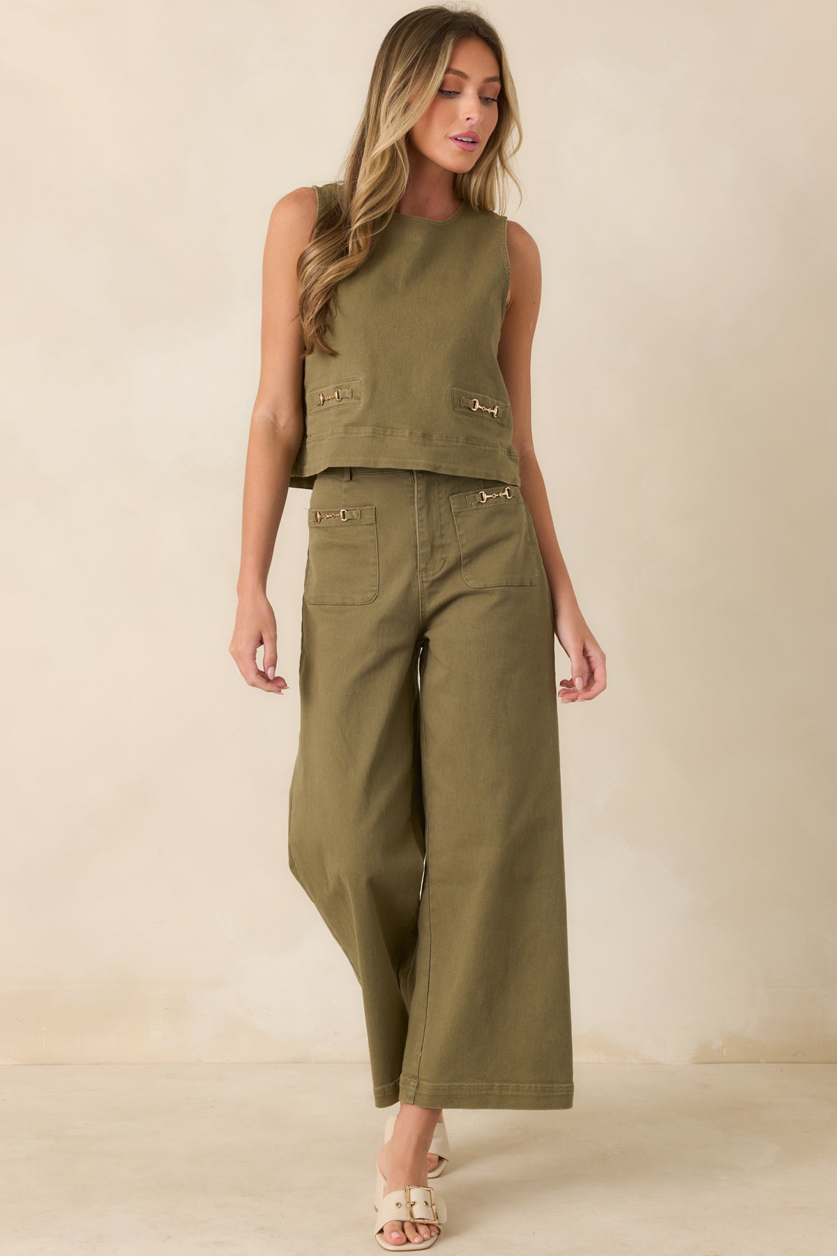 Cotton-blend denim top with a relaxed fit, slightly cropped hem, and decorative front welt details.