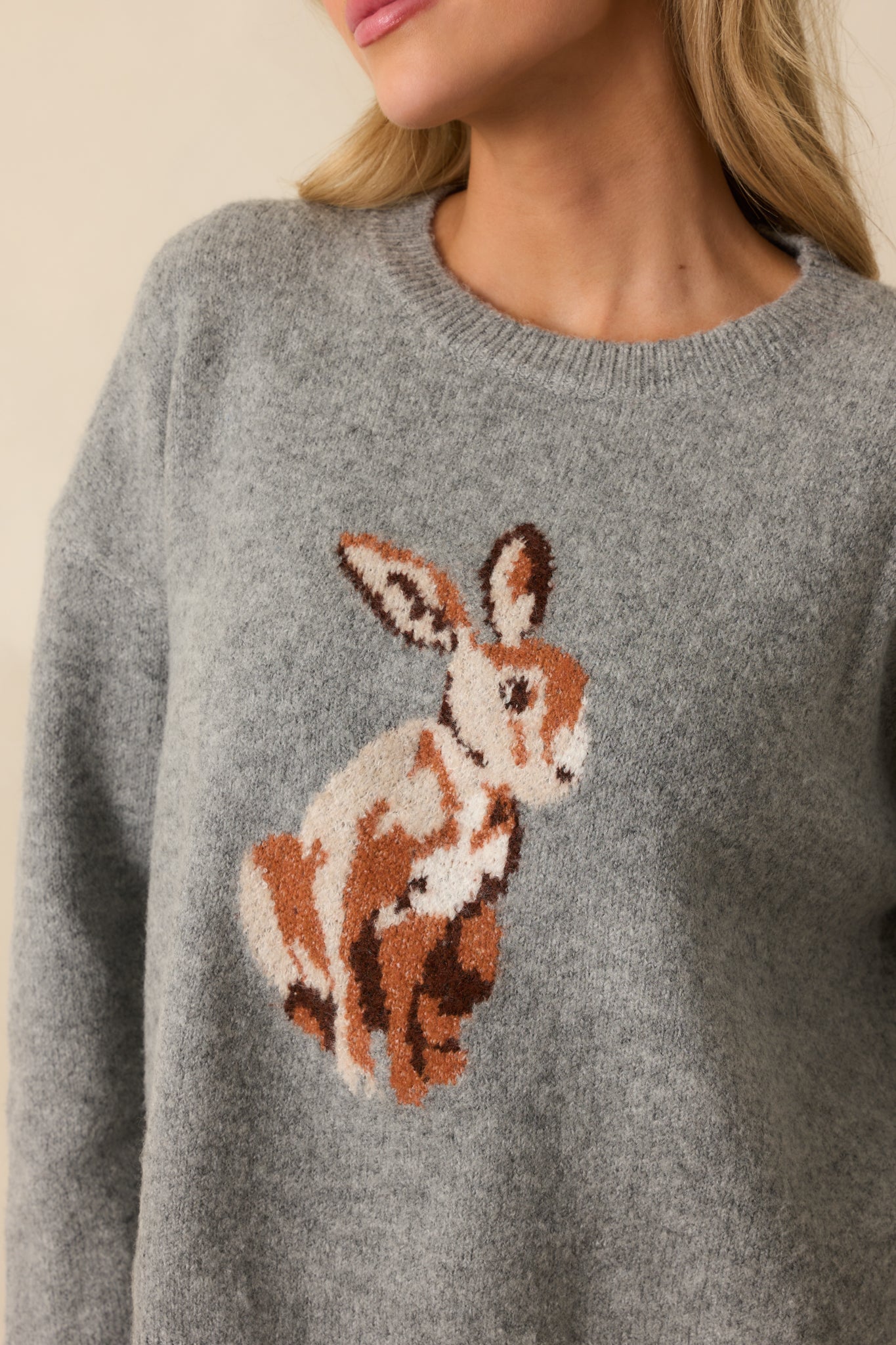 Detailed shot of the bunny graphic and ribbed knit fabric.