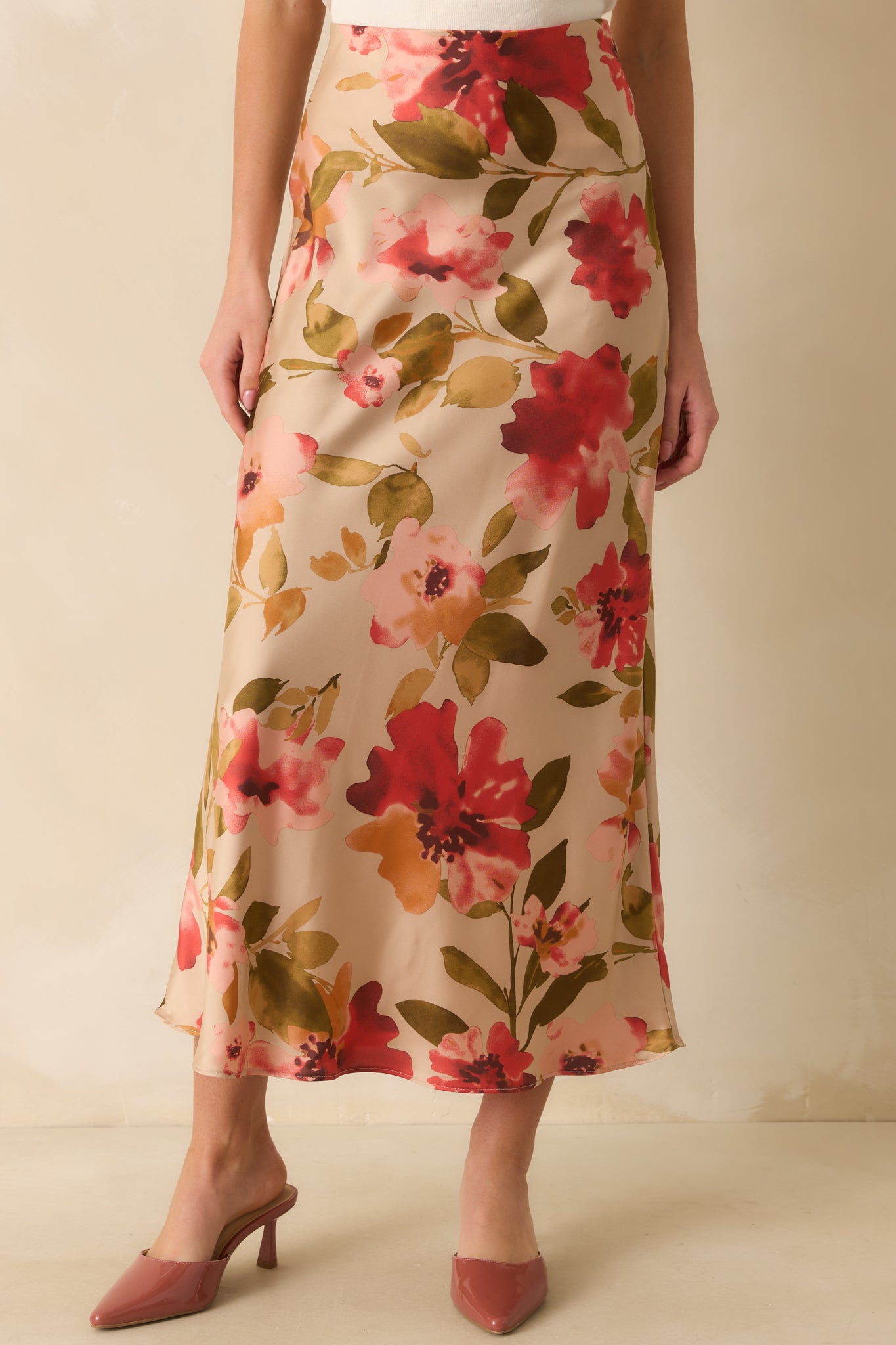 Detail of the flowing hem and delicate pink floral accents.