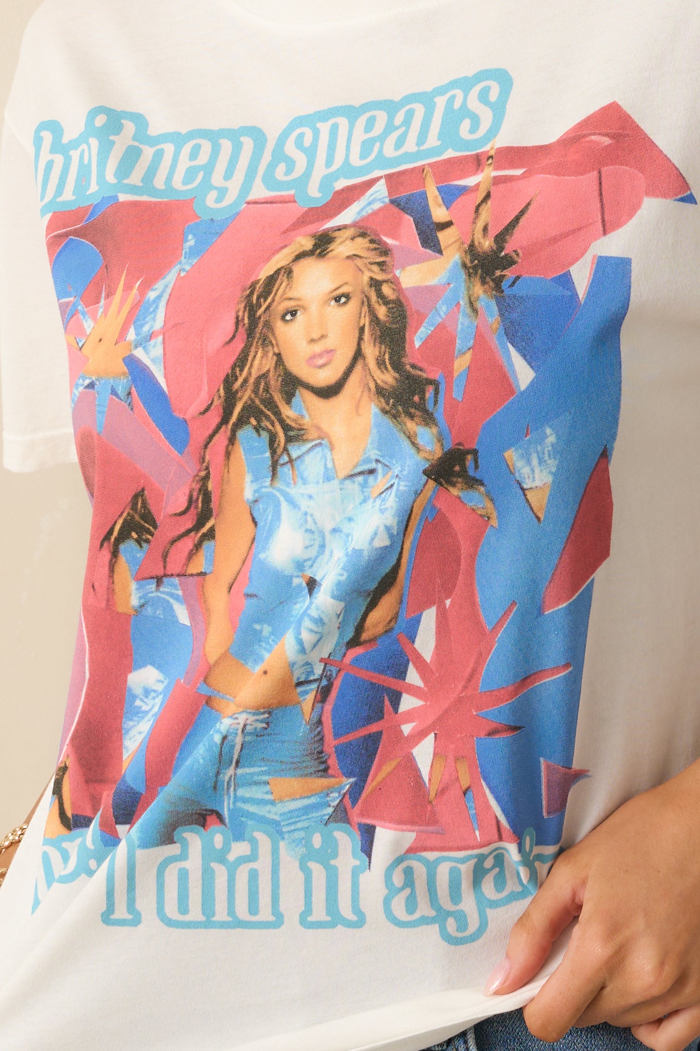 Close-up detail of the tee’s front design featuring Britney Spears imagery and text accents.