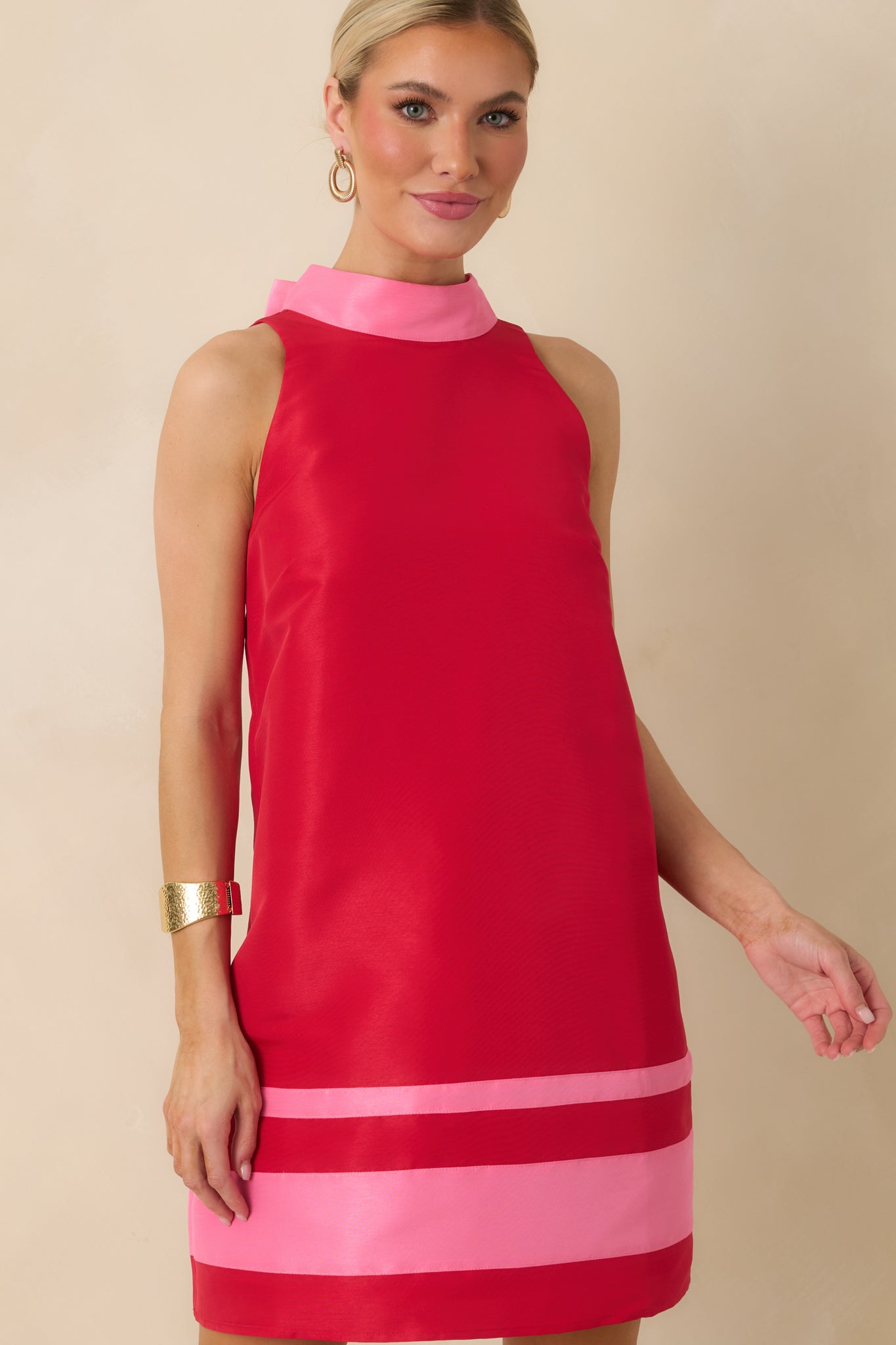Front detail of the mini dress emphasizing the sleeveless cut and structured construction.