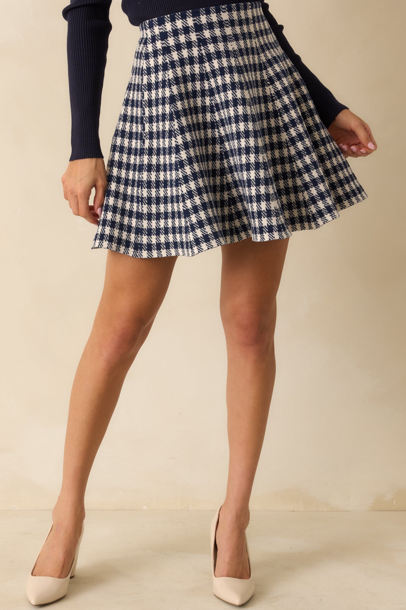 Detail of the soft stretch knit fabric and textured gingham pattern.