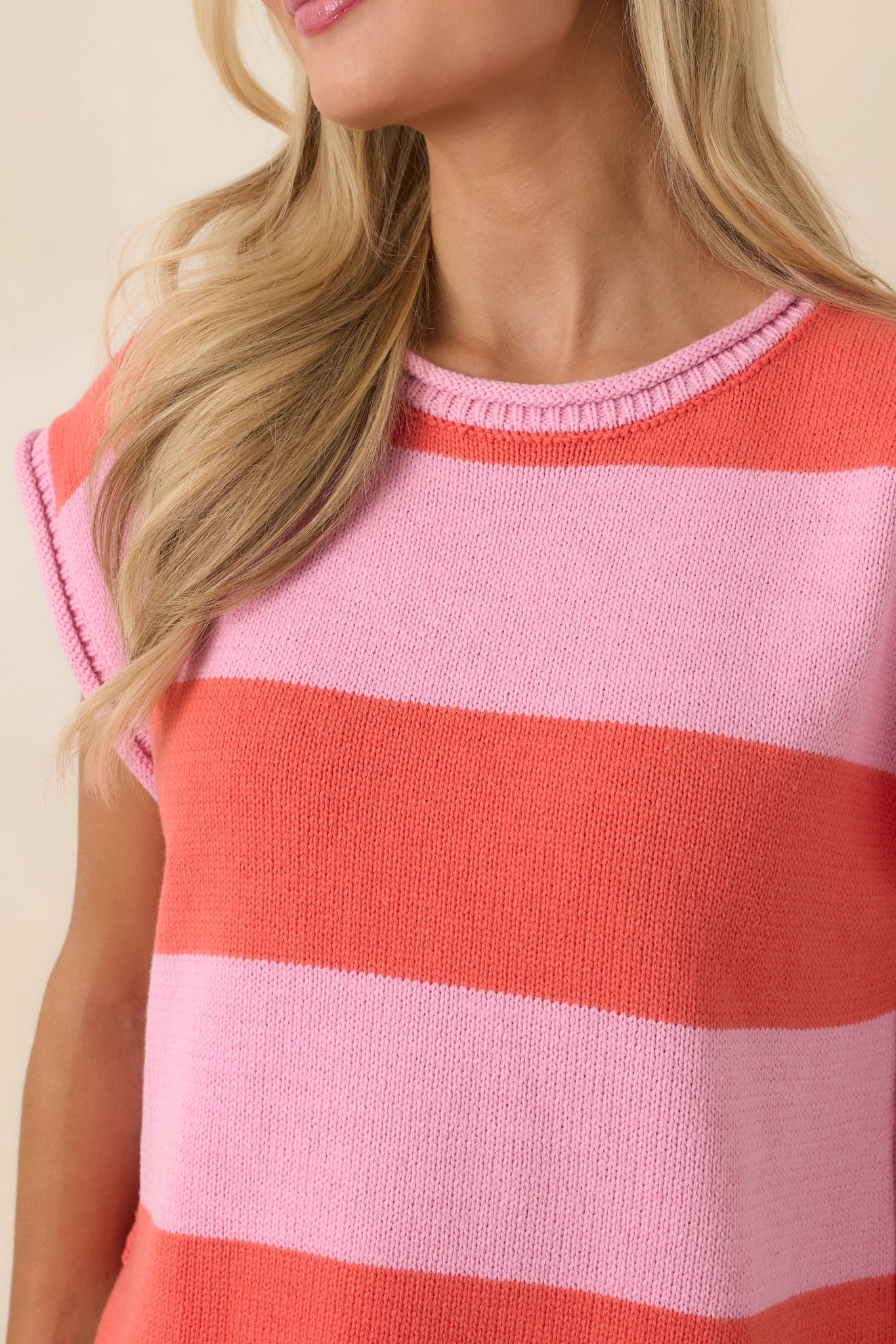 Detailed knit texture showcasing soft fabric and horizontal stripes.