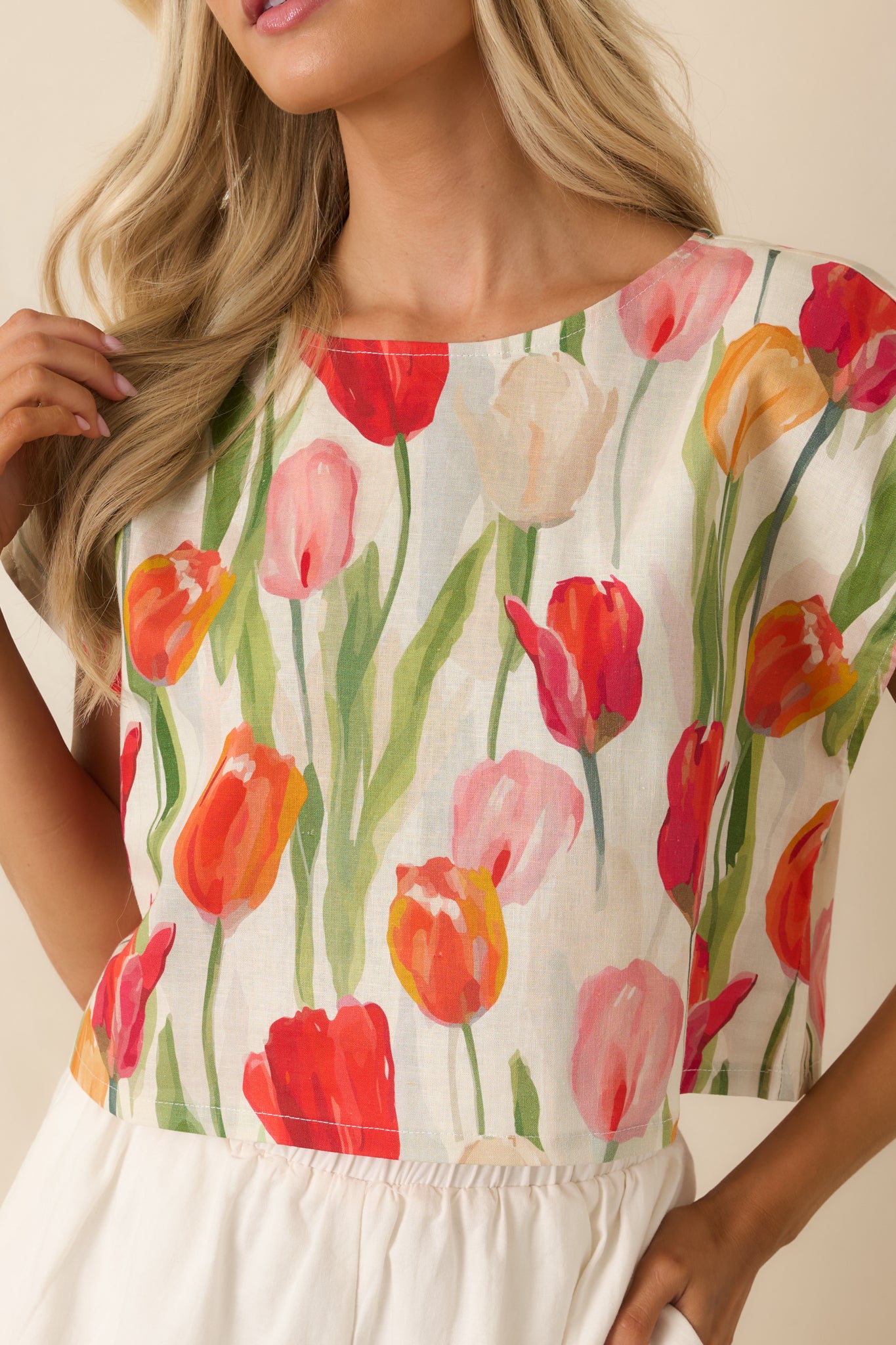 Detailed look at the colorful tulip print fabric with ivory linen blend material, soft texture, and vibrant floral pattern.