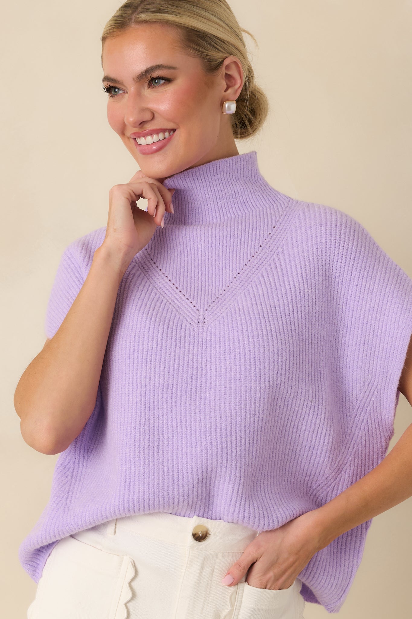 Detailed look at the subtle knit pattern across the chest.