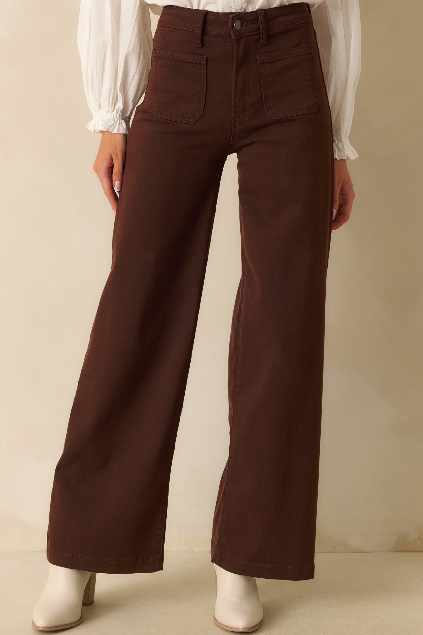 Detailed view showing the high-rise waist and straight-leg silhouette of the jeans.