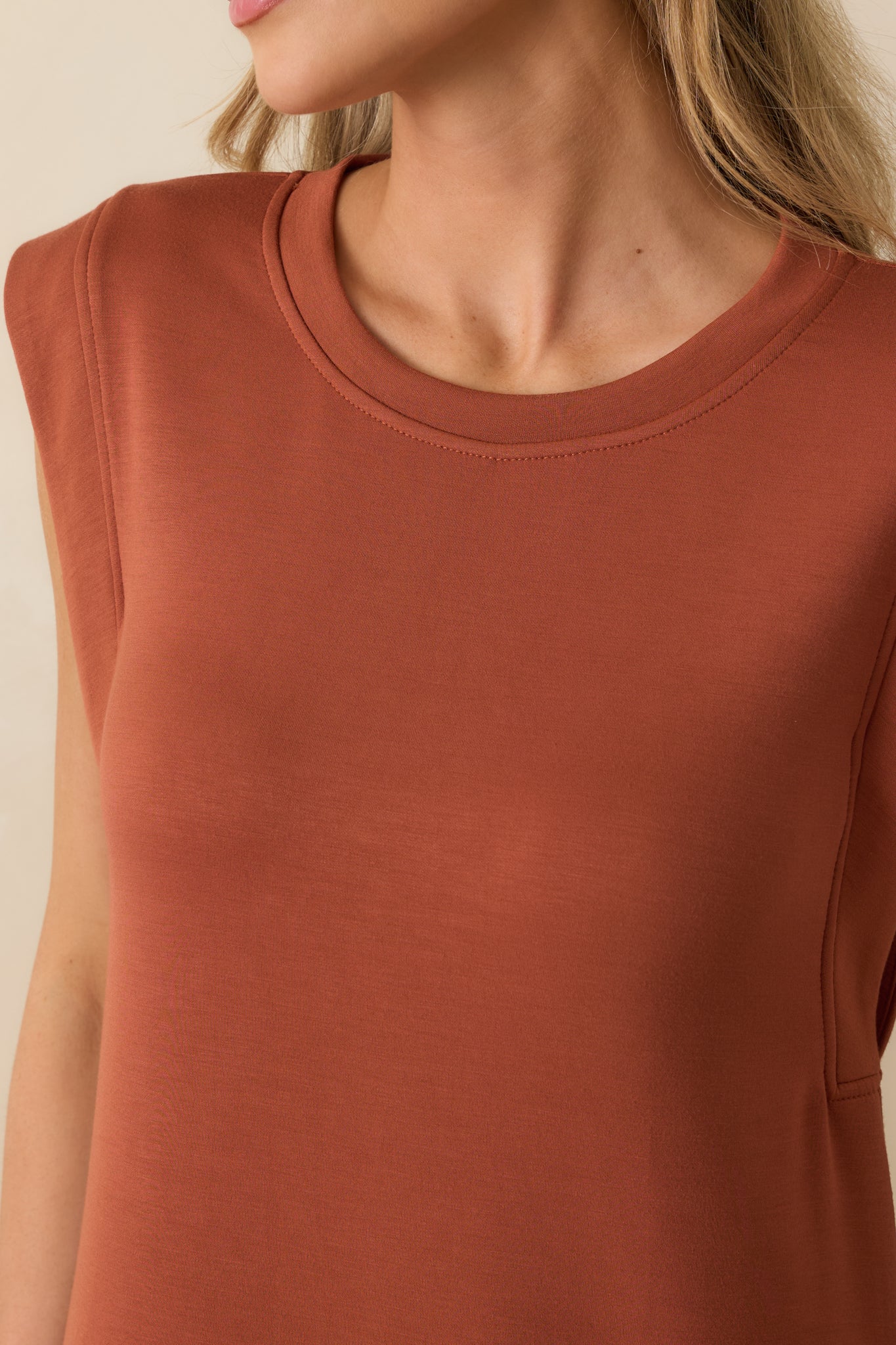 Detailed view of the terracotta maxi dress fabric showing ultra-soft cotton blend texture and stitching.