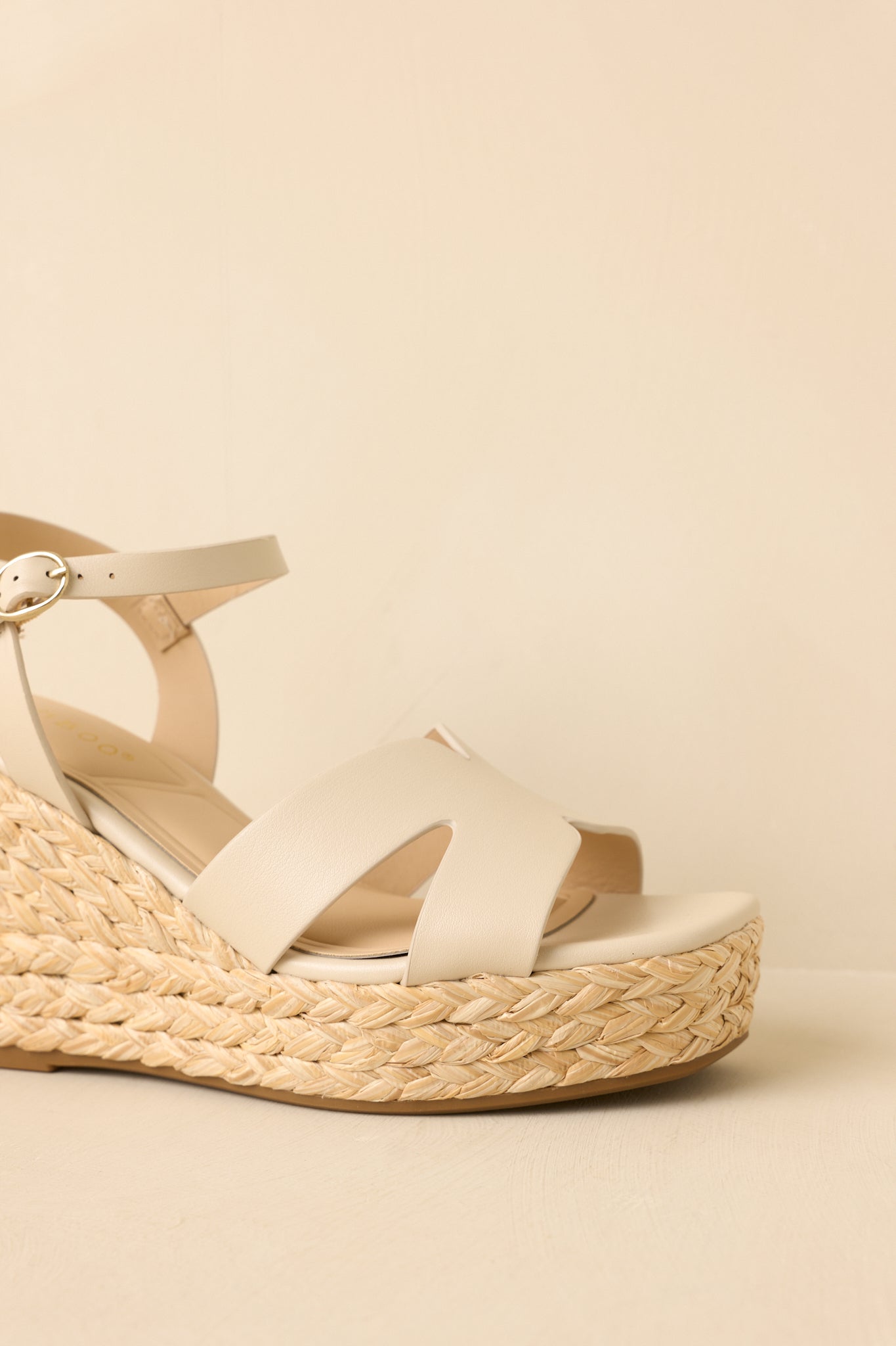 Detailed view of the woven espadrille-style wedge texture paired with the cushioned footbed for added comfort.