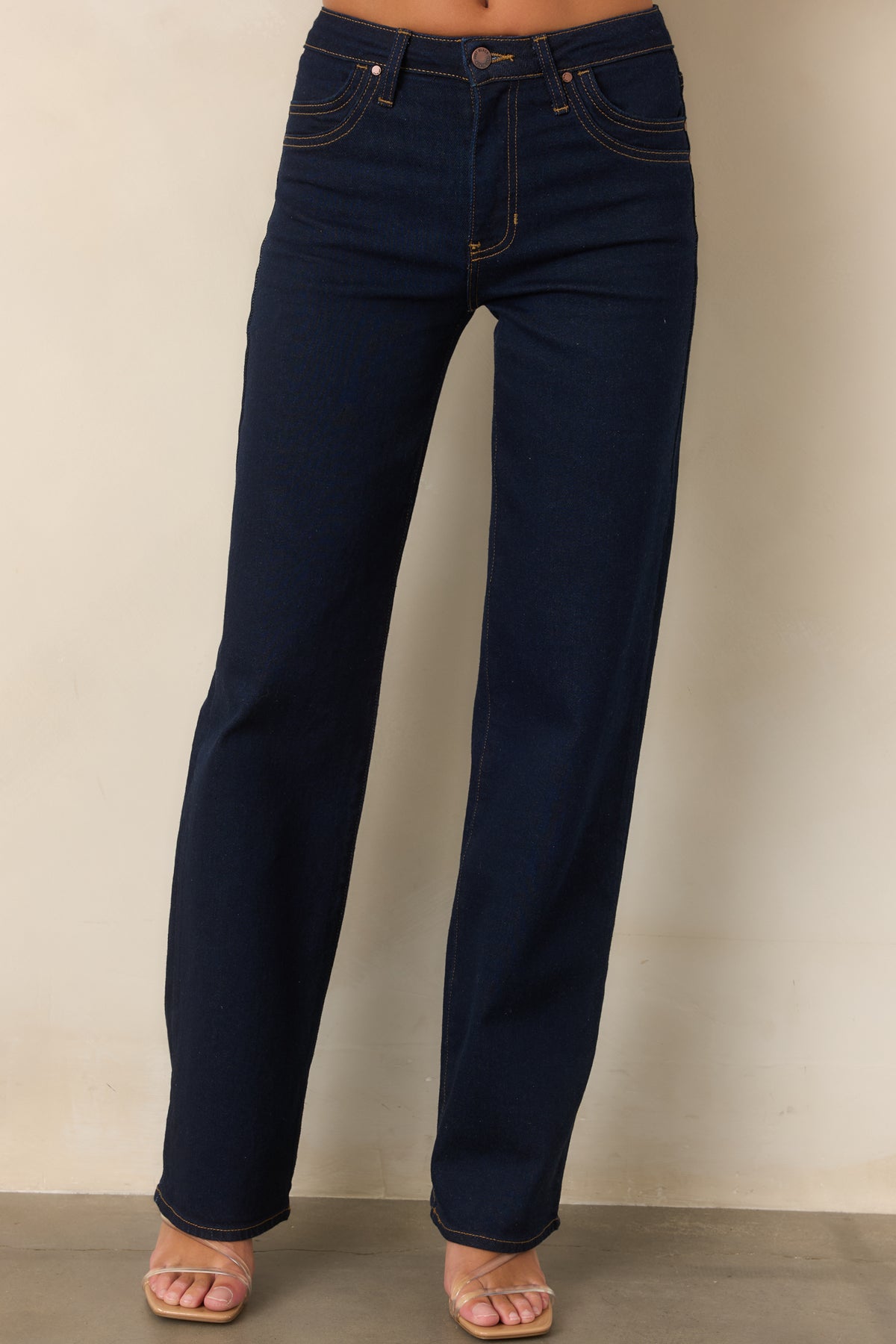 Close-up of the double-row stitching and deep indigo stretch denim at the front pockets.